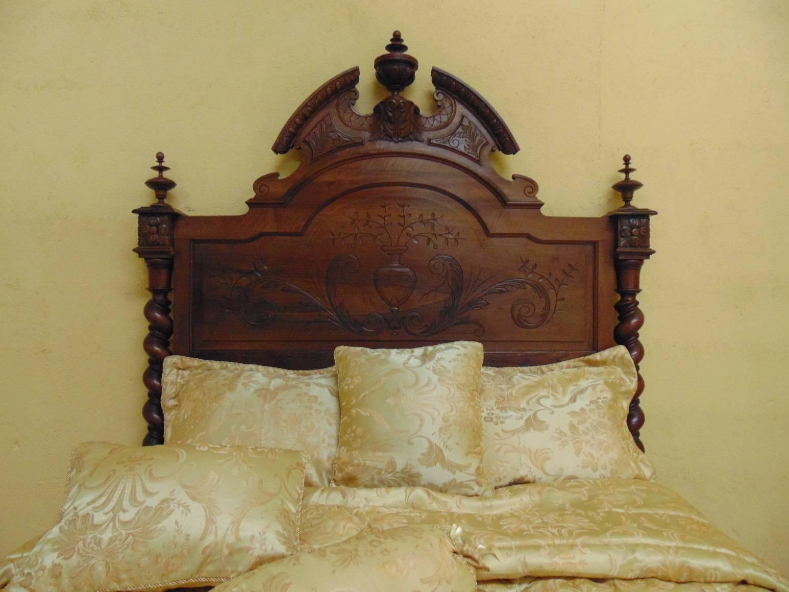 Unusually fine quality hand-carved Renaissance Revival chateau bed in the Louis XIII style in solid walnut, circa 1880.
PLEASE NOTE 
European beds of this age very seldom conform to modern mattress sizes. We therefore provide free with every bed we