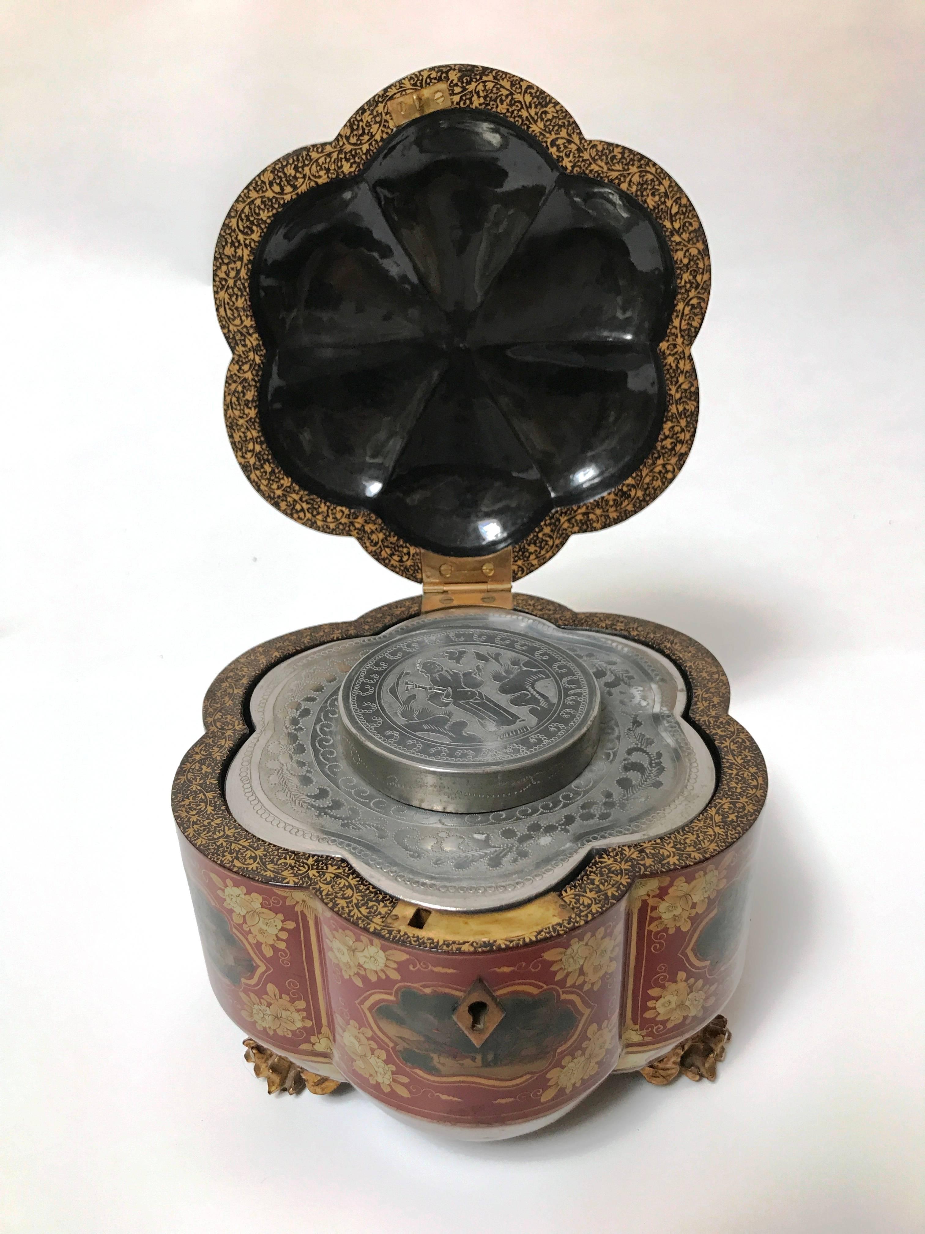 Lovely and rare red melon form Chinese export tea caddy, circa 1830, with original melon fitted liner, feet and stem finial

A perfect example of export lacquer.