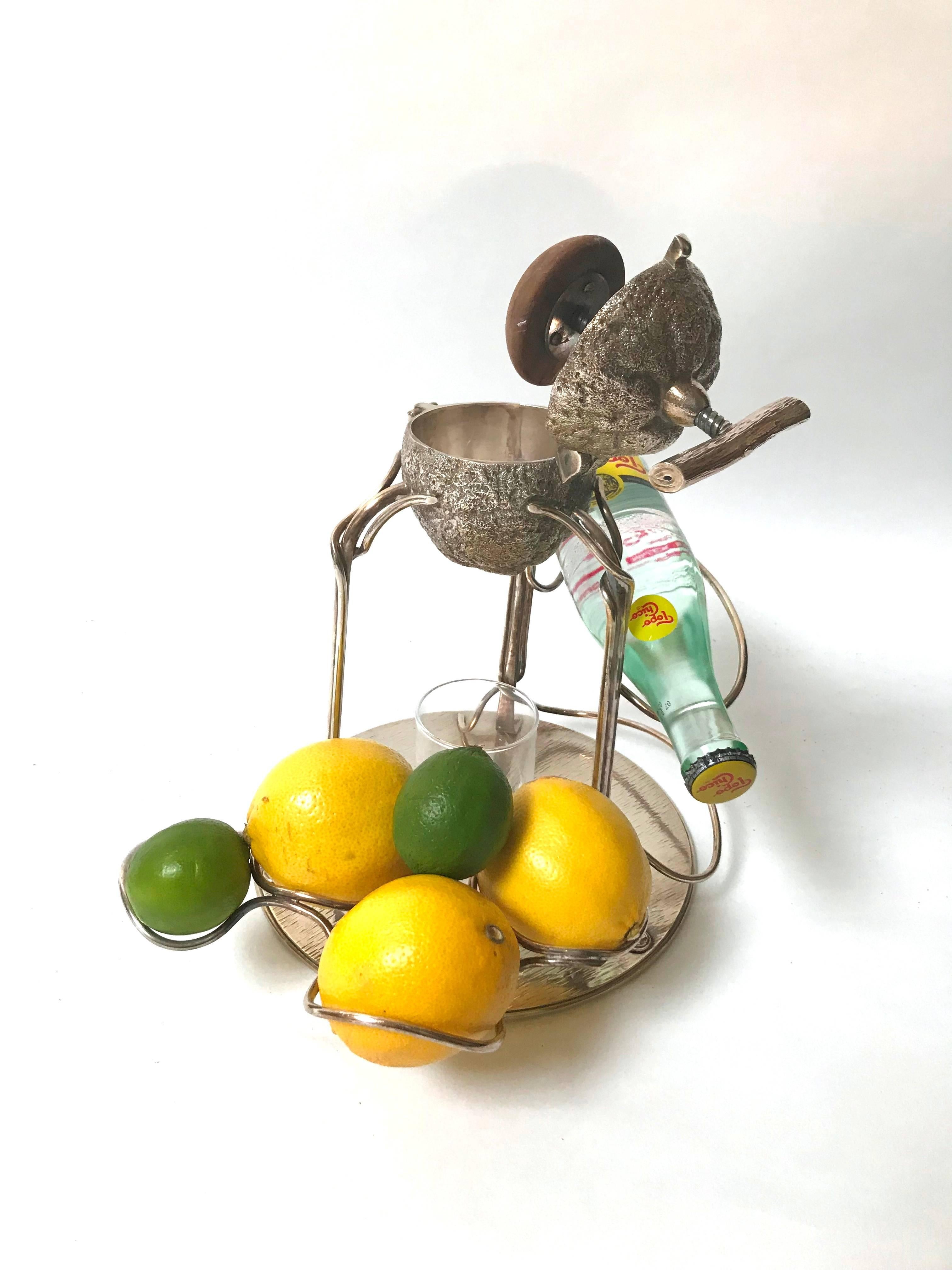 Rare silver plate lemon squeezer and soda stand by noted silversmiths Hukin and Heath of Birmingham, England, stamped with maker's marks and registration number

The central stylised lemon is supported by entwined rods that transform into supports