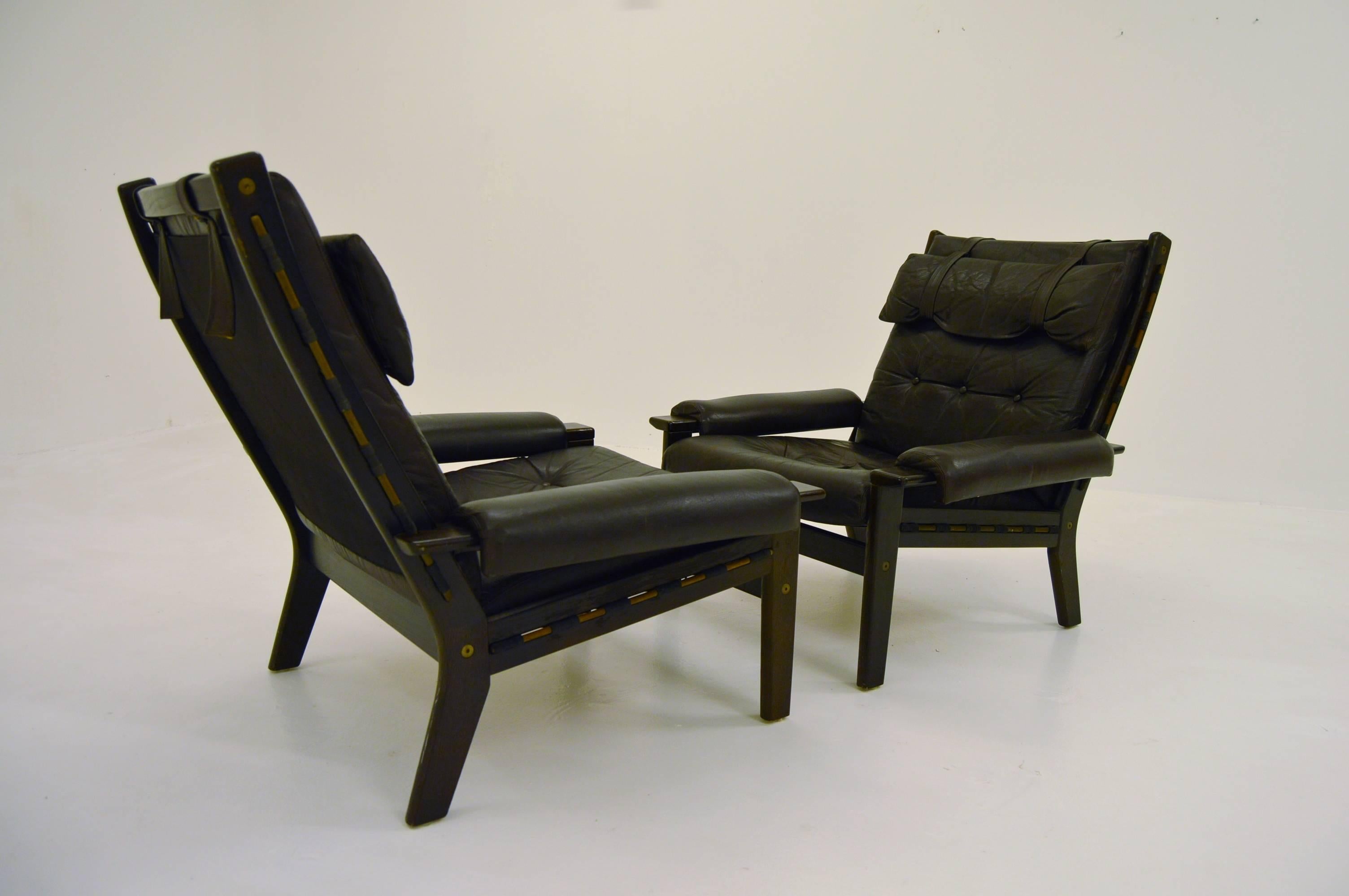 Nice and elegant pair of lounge chairs. Unknown designer and manufacturer. Most likely produced in Scandinavia during the 1970s.

Dark chocolate brown leather and wood that appears to be wenge.

Very good vintage condition.