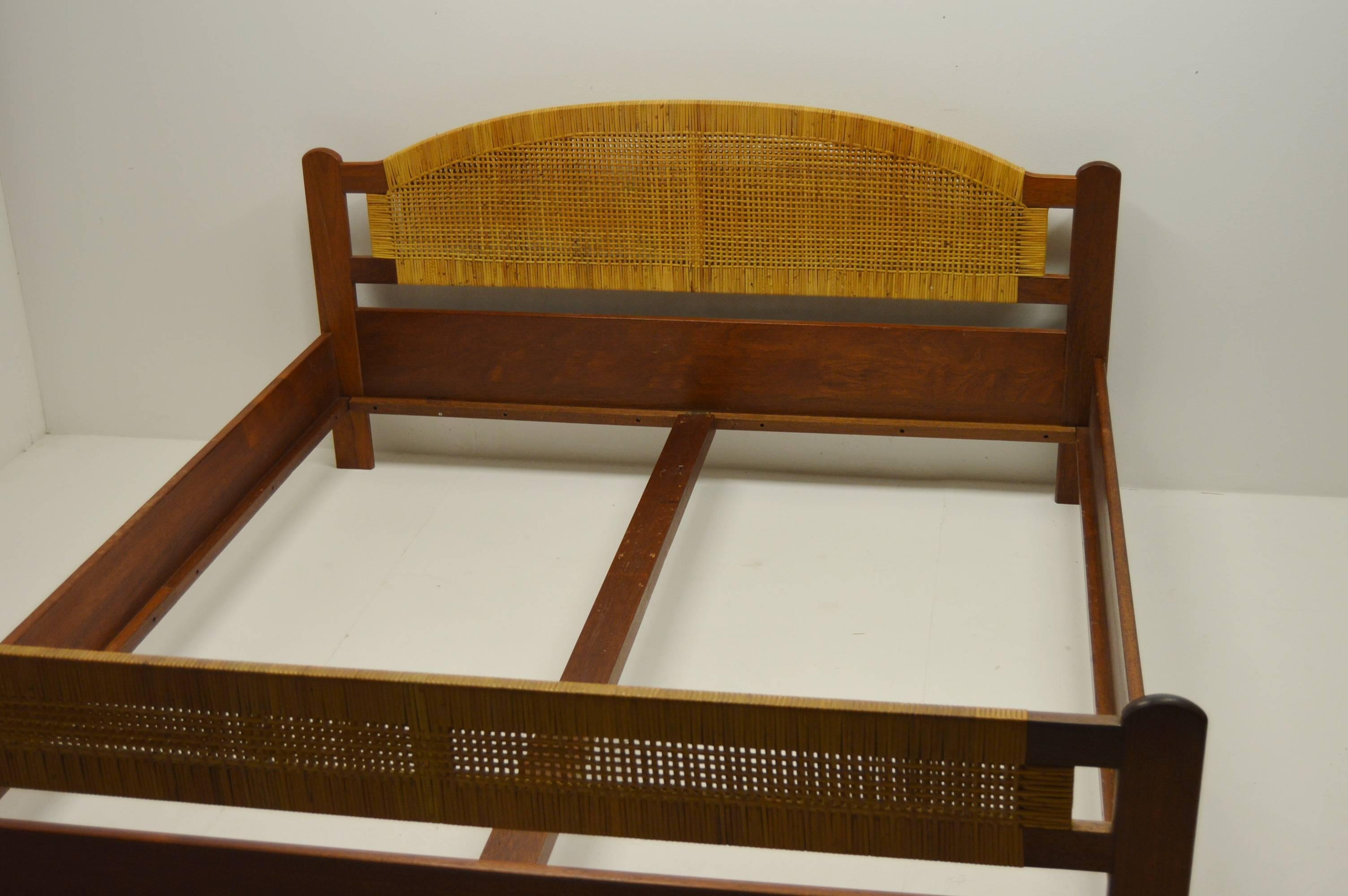 Lovely teak and rattan bedframe manufactured in Denmark in the 1960s.

- Two person bed.
- Bed measurements 201×181 cm. 
- Largest height 95 cm.