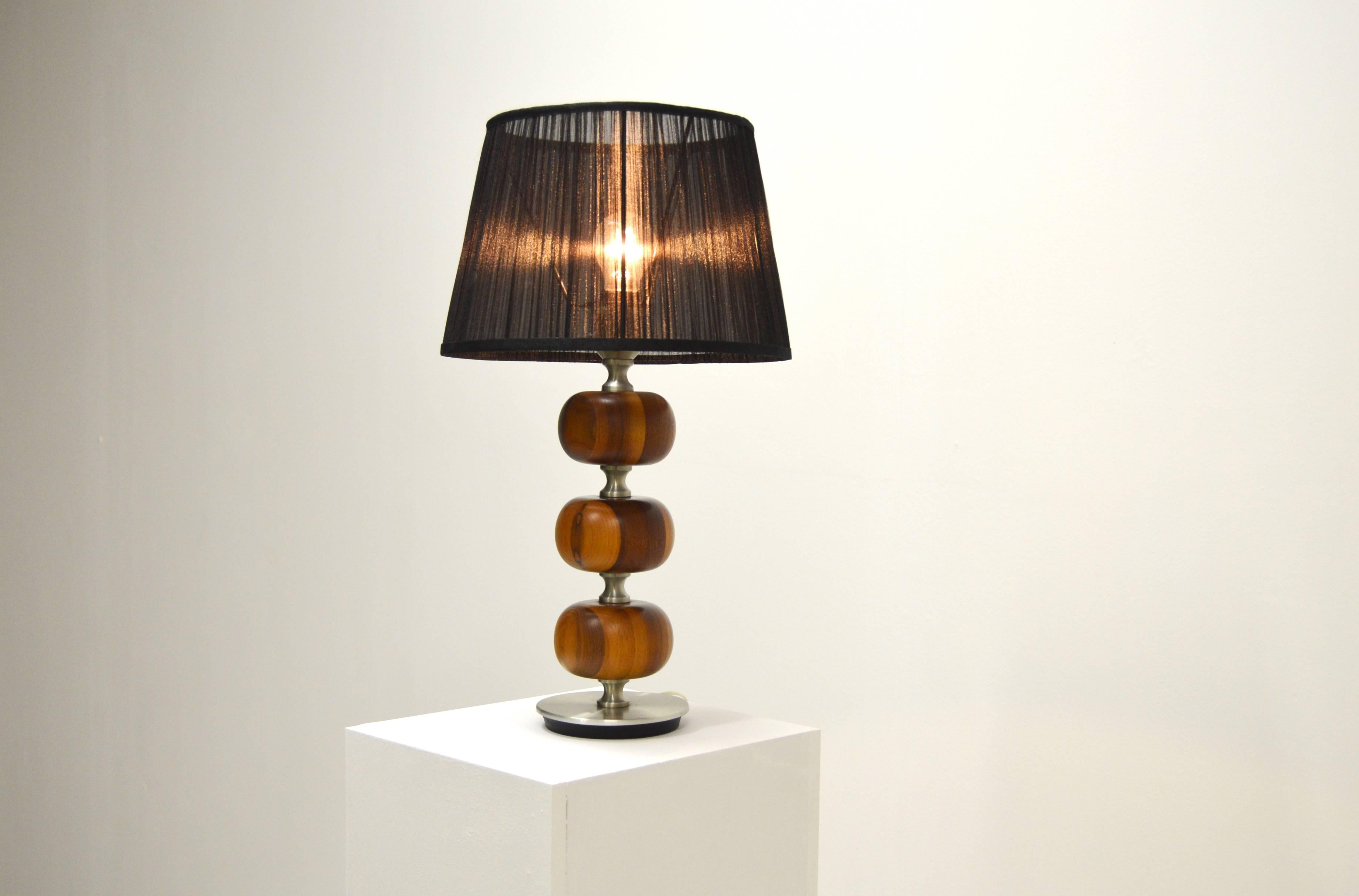 A beautiful table lamp by Henrik Blomqvist.
Made from bulbuous mahogany and aluminium.

The lampshade is new and the lamp is best to be sent in a box without lampshade for more economic and fast shipment.
Height below is given without the