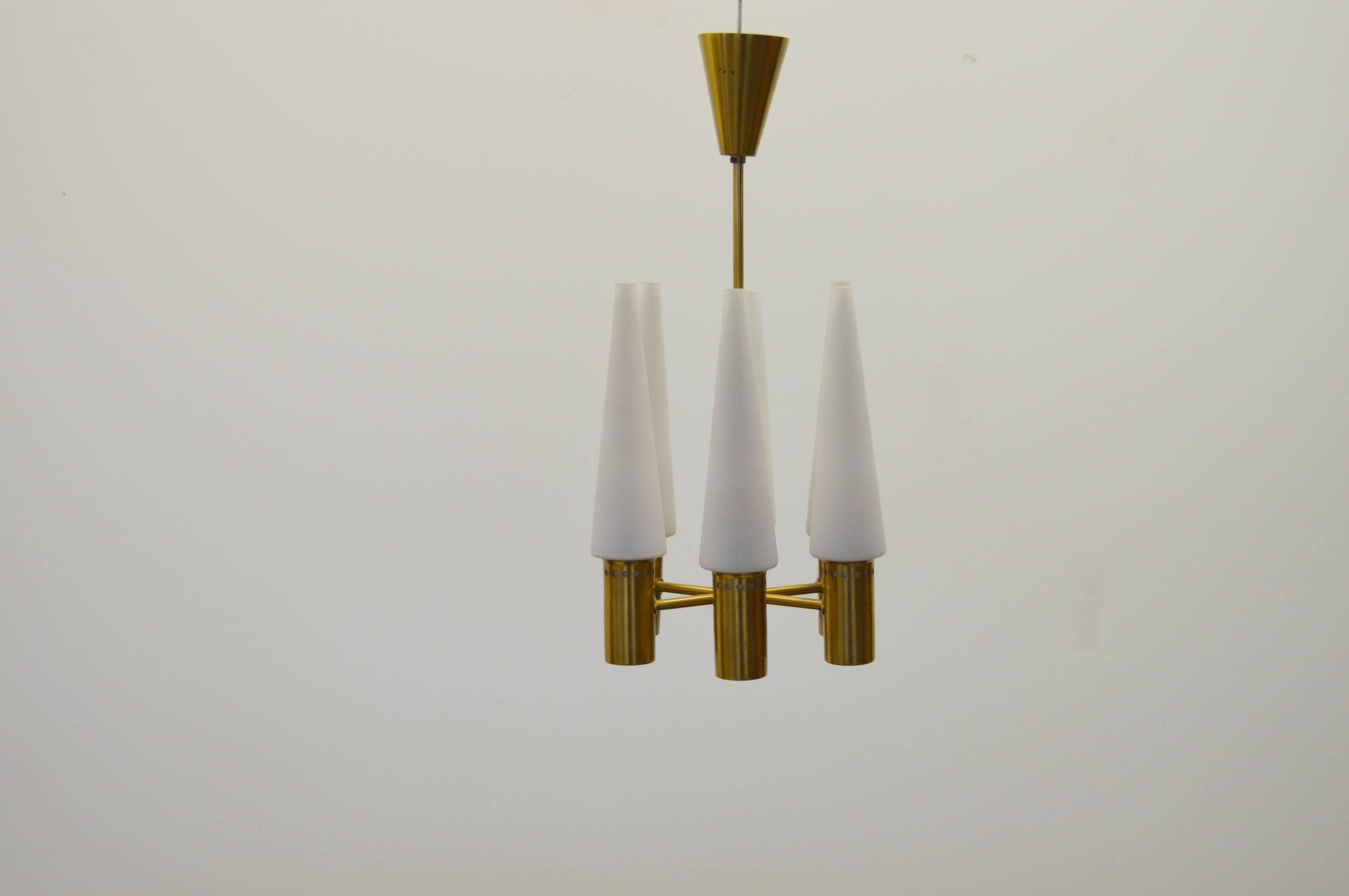 Chandelier with six-light points. Designed by Hans-Agne Jakobsson for his own company Hans-Agne Jakobsson AB in Markaryd Sweden.
Brass and opaline glass.
 