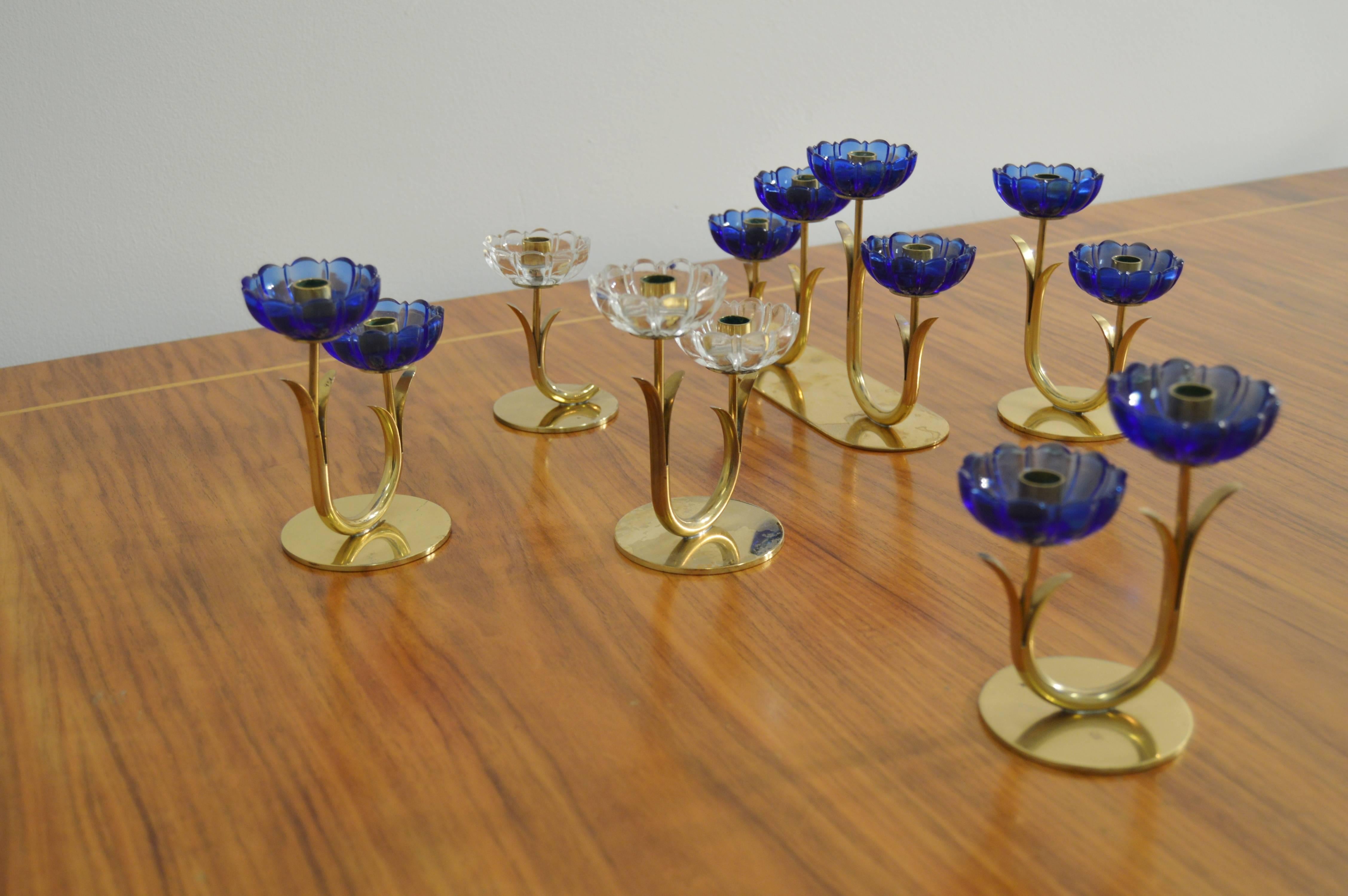 Set of six candleholders by Gunnar Ander for Ystad Metall.
year circa 1950.
Brass and colored glass in very good vintage condition.
Measures is for the largest one, but the height is the same for all in the same length range.