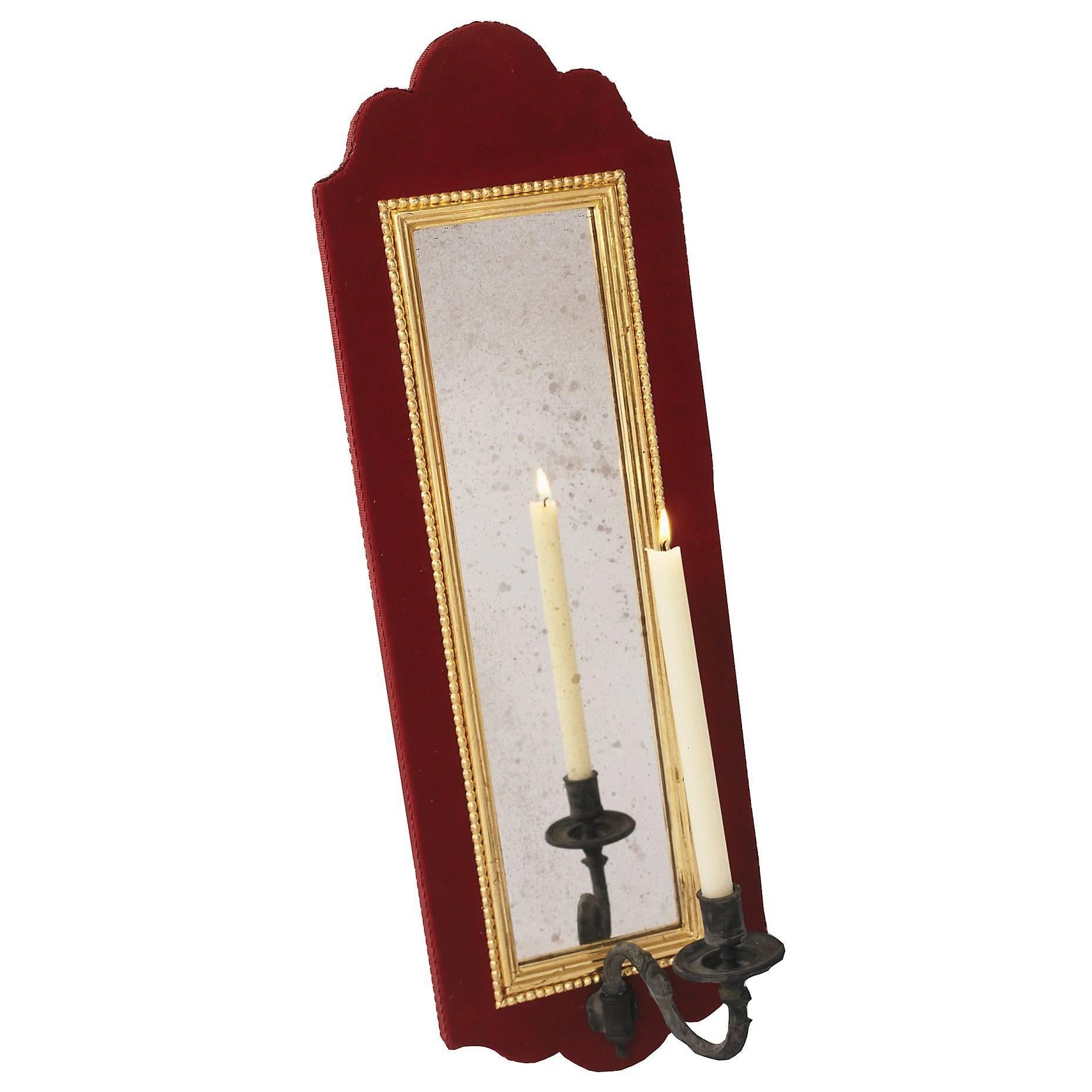 The Nero mirrored Girandole candelabra designed by Alidad Ltd and Thomas Messel and inspired by Baroque and neoclassical designs is shown here in black Crocagator finish with gilt filleting at edges and bronzed candleholder
Also available in a