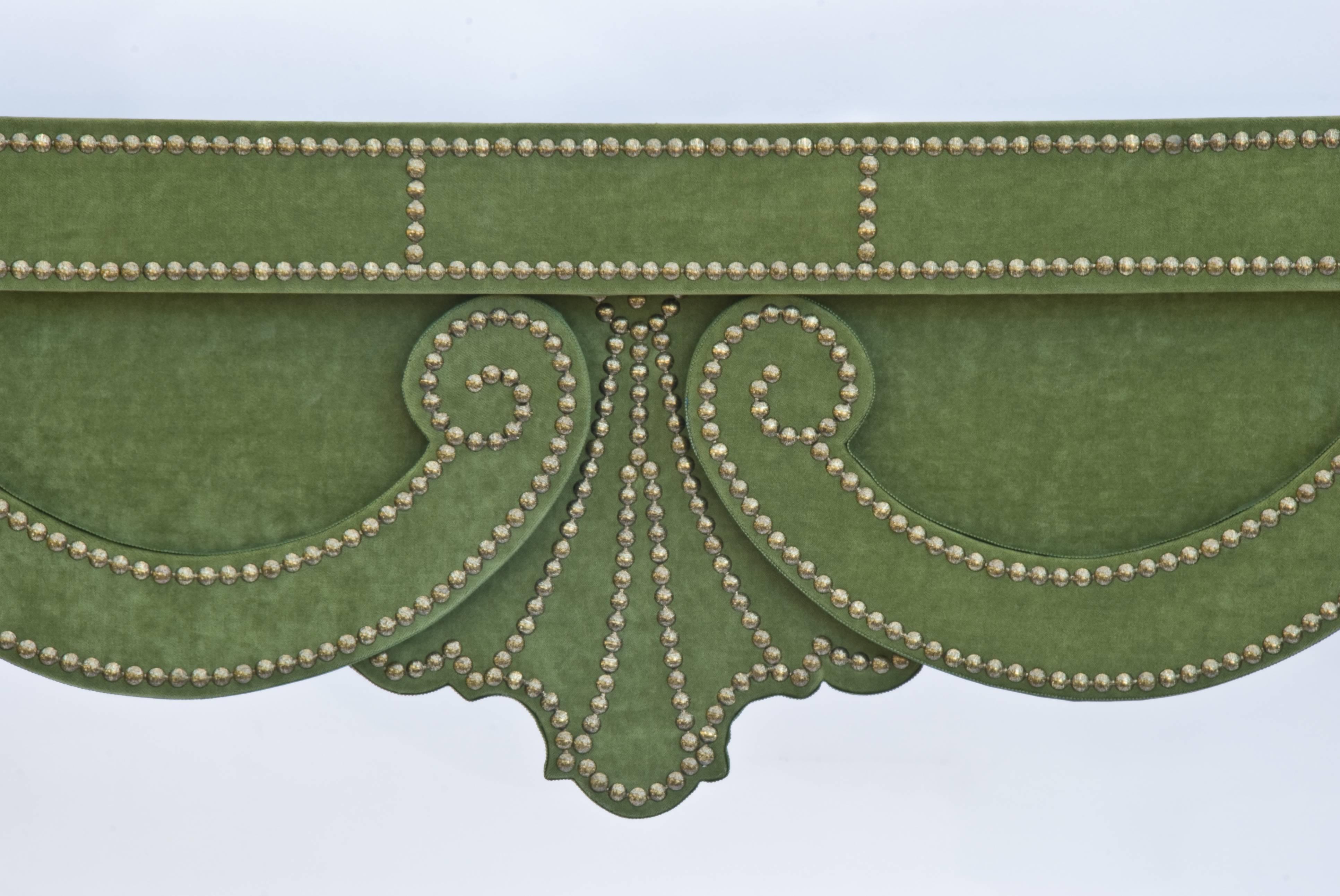 The Augustus velvet console table, shown here in studded green velvet with limestone top, is part of the velvet furniture collection designed by Alidad Ltd and Thomas Messel and based on Baroque and neoclassical shapes. It can be customized in a