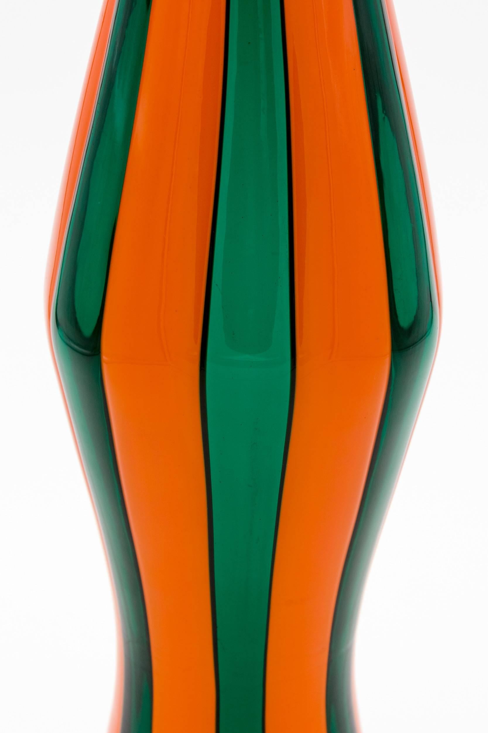 A rare vase in vibrant color combination of green and opaque orange glass.