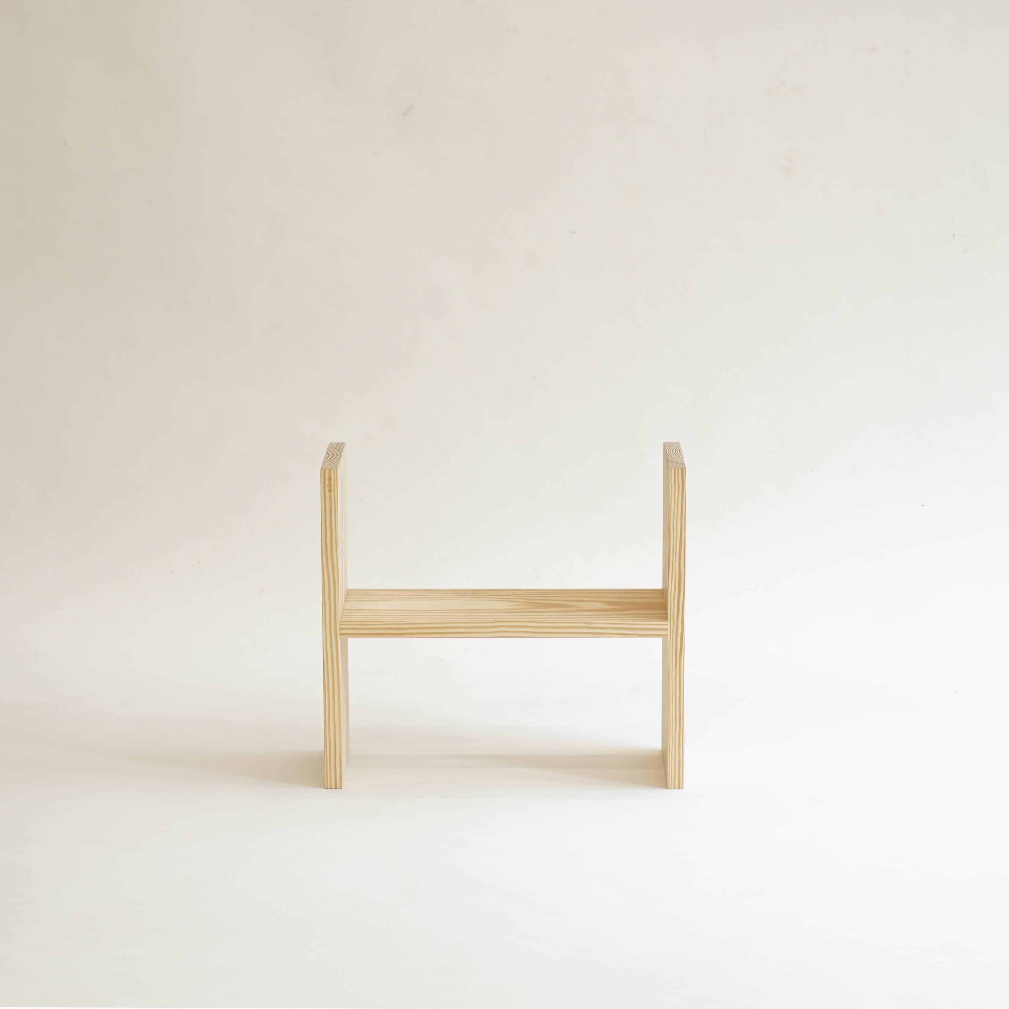 Alexa, designed by contemporary artist Sophie Nys, is a simple, low piece for various uses made in untreated yellow pine. Three wooden plates are connected to make an H-shaped object. It has no pre-defined direction, can be turned round and used