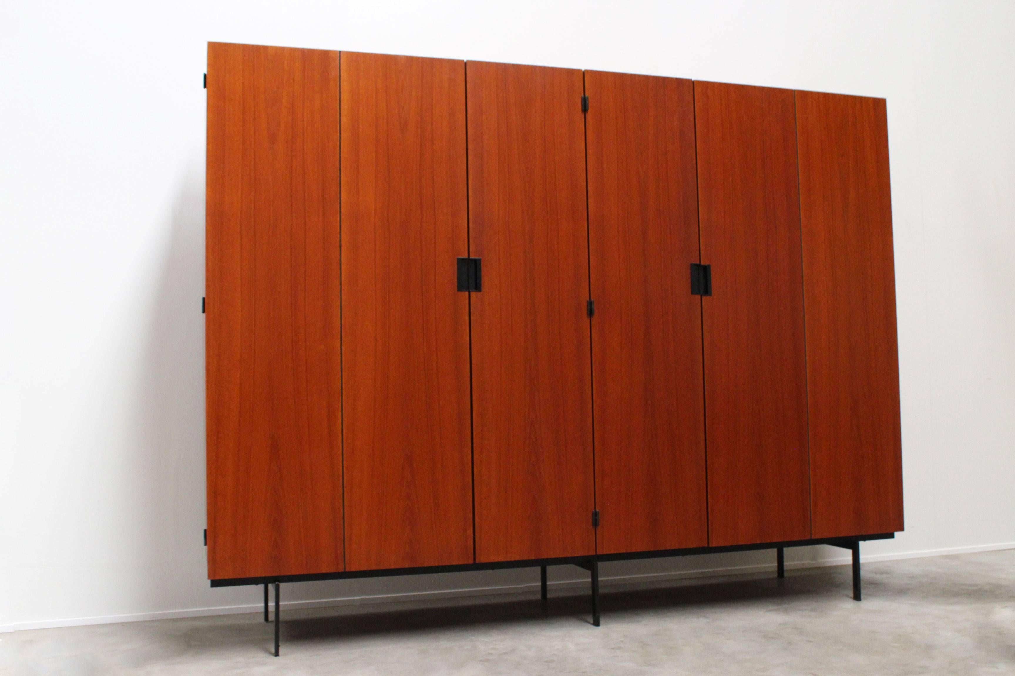 Large KU-16 Japanese series cabinet designed by Cees Braakman for Pastoe, 1958. Cees Braakman's Japanese series is known for its Minimalist look and warm teak colors. Cabinet interior with multiple shelves, mirror, sock storage, tie storage and