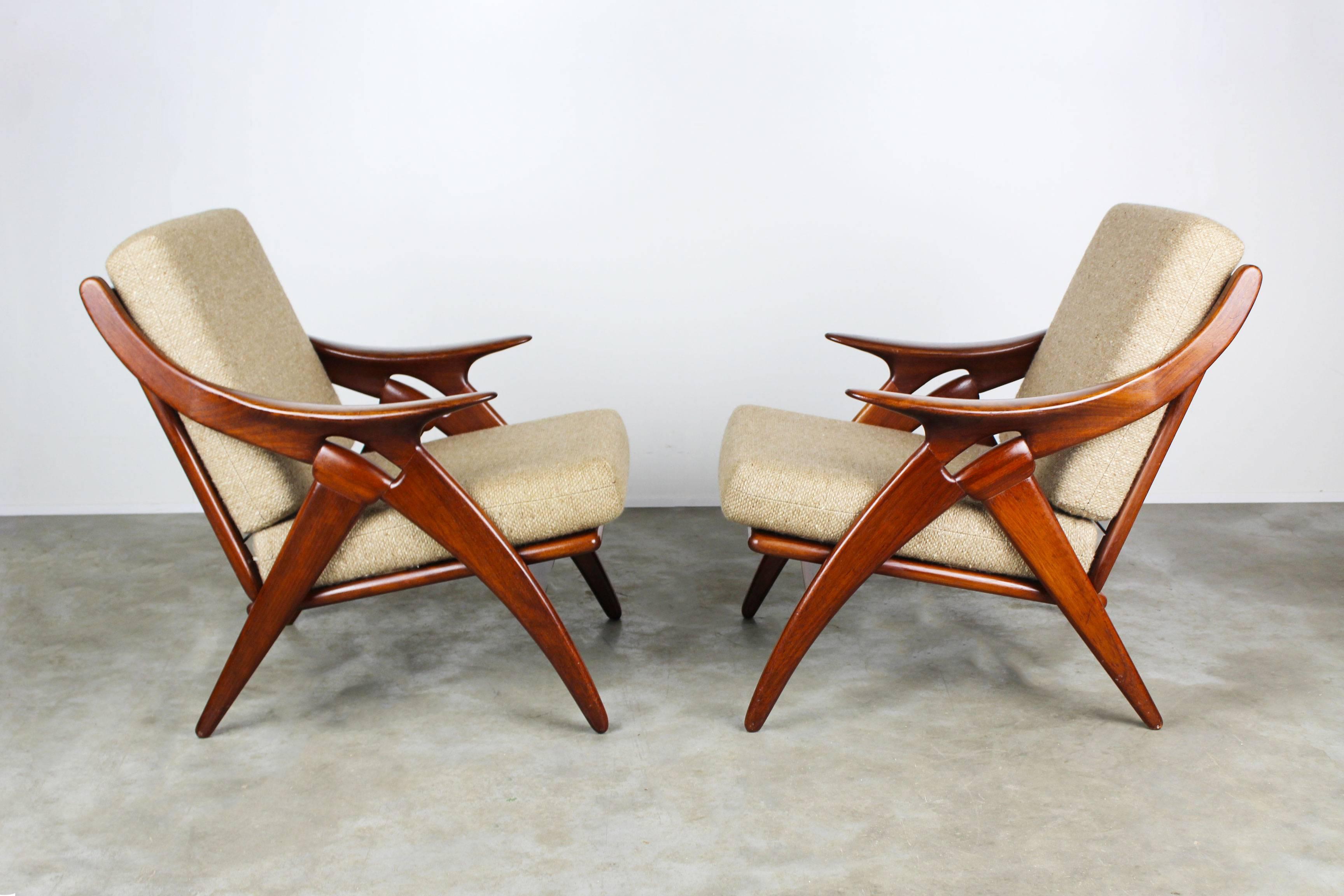 Set of two "De knoop" lounge chairs Dutch midcentury design by: De Ster Gelderland. The chairs are named "The Knot" refering to the unique teak shaped frame. The frame is made from solid teak and its shape always grabs your