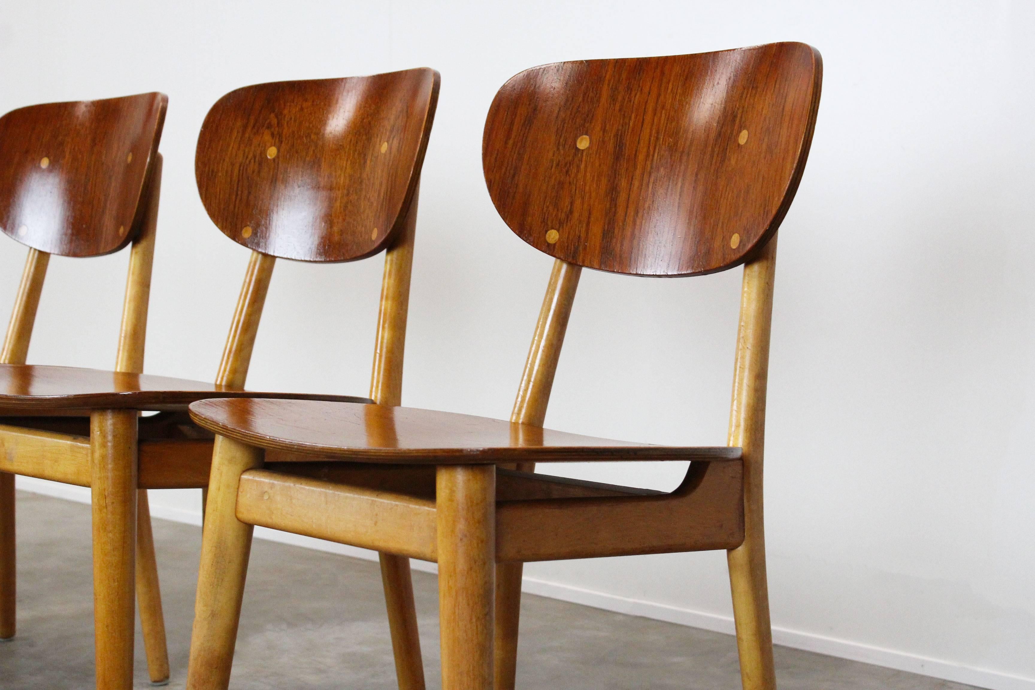 Set of four dining chairs model SB-11 designed by Cees Braakman for Pastoe, 1950 combex series. This model is harder to find then the SB13 model. Wonderful combination of beech and teak wood. Very comfortable dining chairs. Some sings of use on the