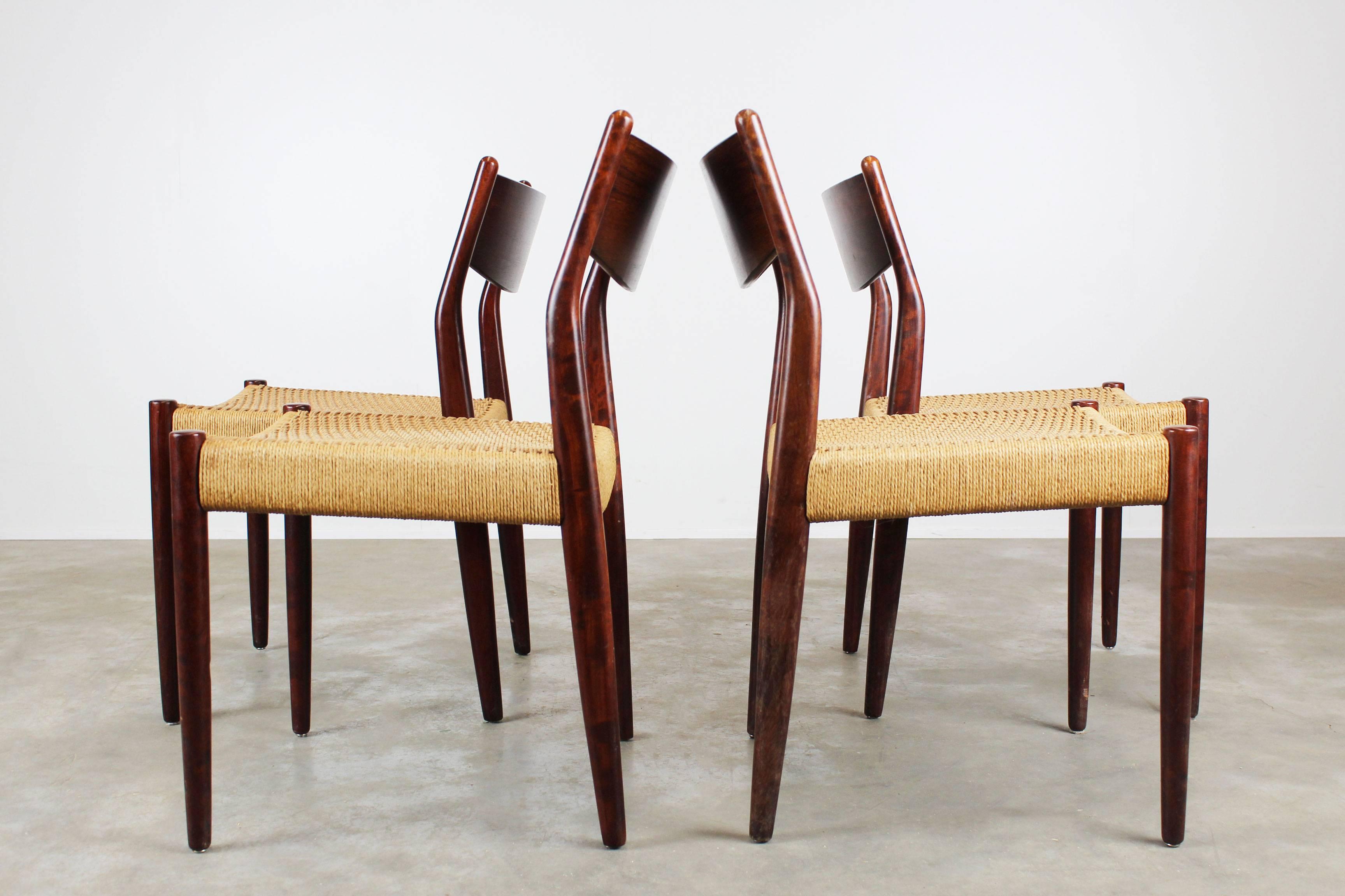 Set of four Dutch design dining chairs produced by Pastoe in 1960s. Heavily inspired by the Danish design styles Pastoe created these wonderful dining chairs with sculpted solid rosewood frame and woven papercord seat. Very comfortable chairs, the