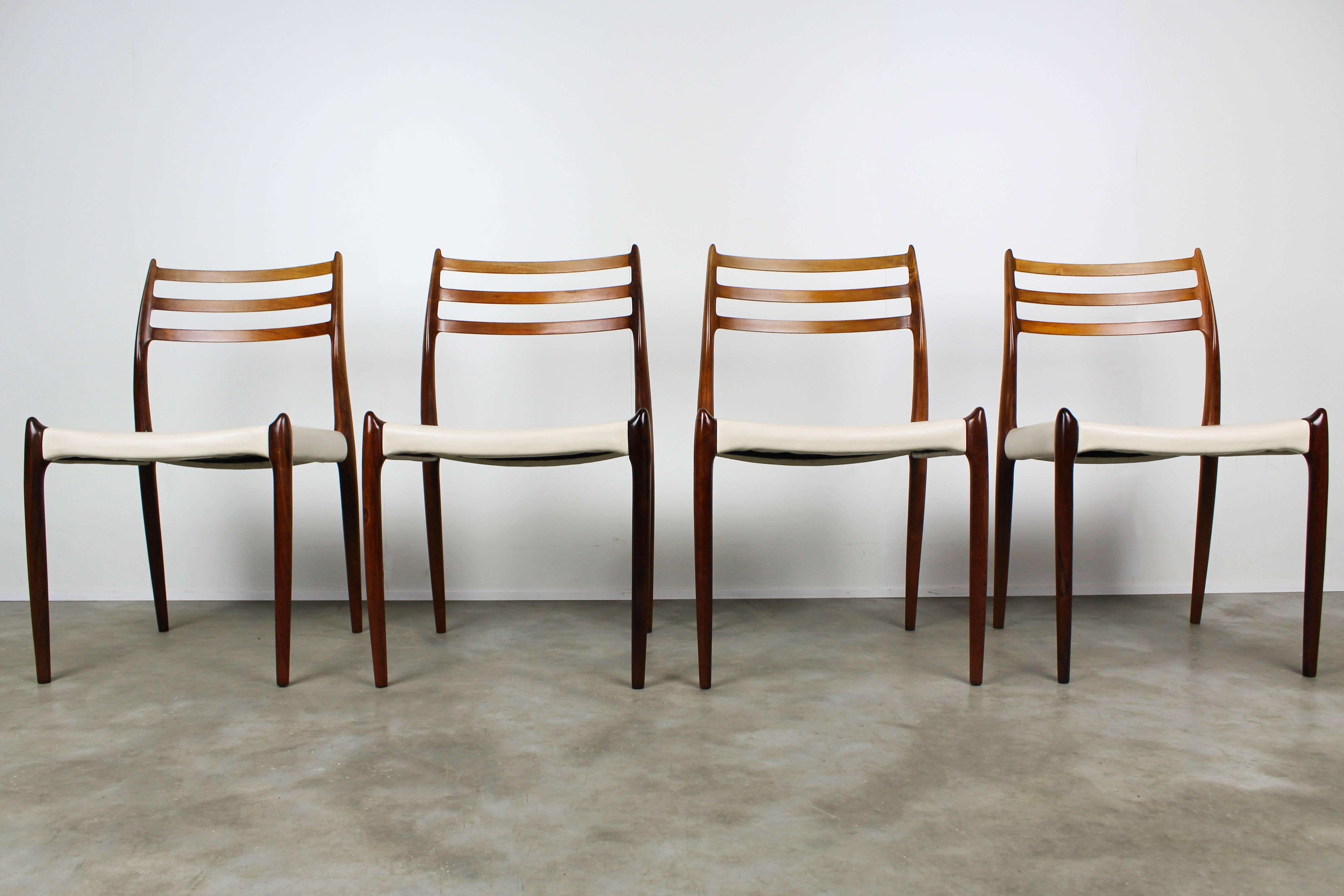Unique and rare set of four ''Model 78'' dining chairs Designed by Niels Otto Moller for J.L Mollers in Solid Rosewood with White leather upholstery produced in the 1950s. High end Danish design with eye for detail and high levels of craftsmanship.