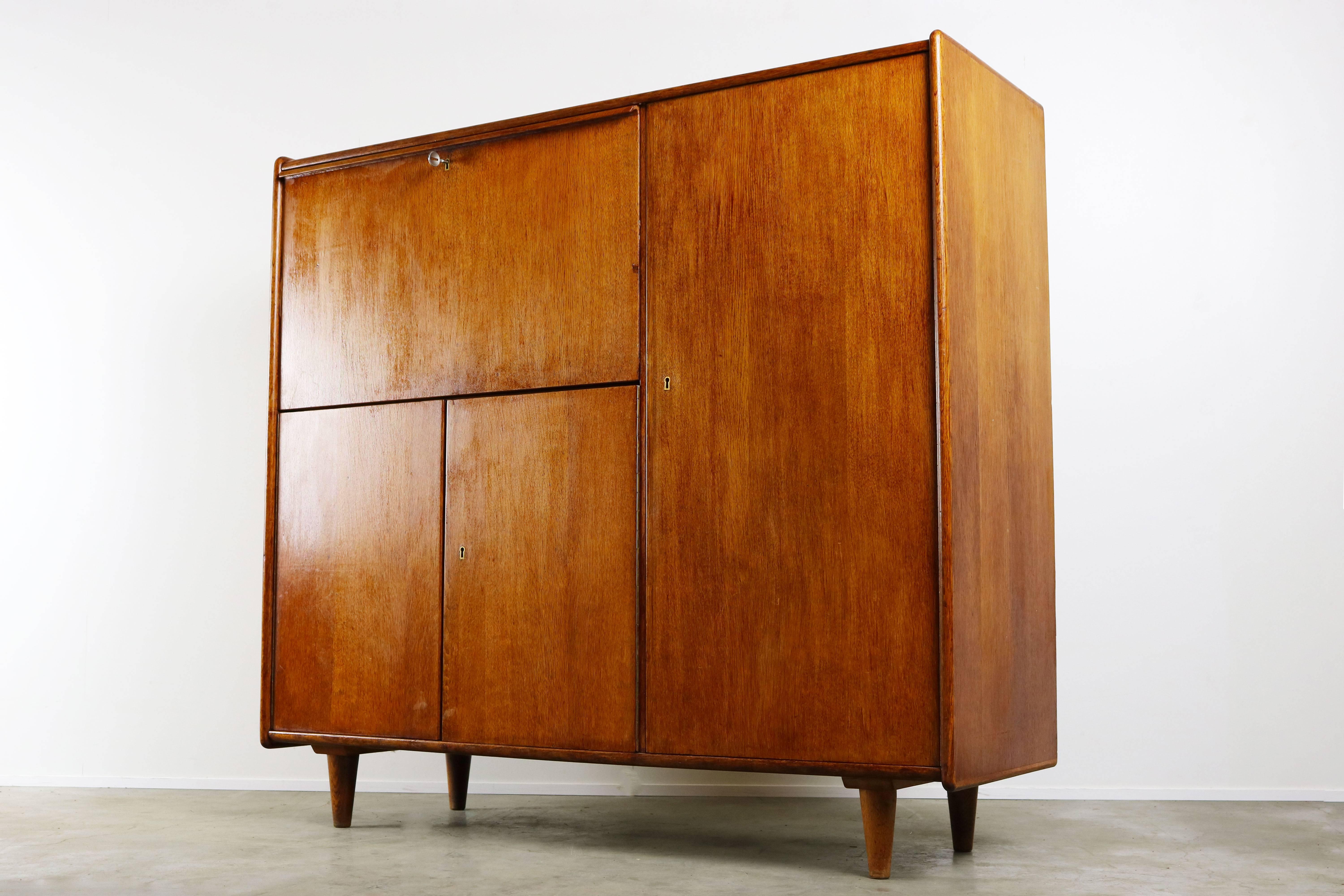 This secretaire from the Oak series was designed by Cees Braakman for UMS Pastoe in the 1940. This is the first production of cees braakman's secretaire design. Later this model changed to well known Birch series and Japanese series secretaire. It