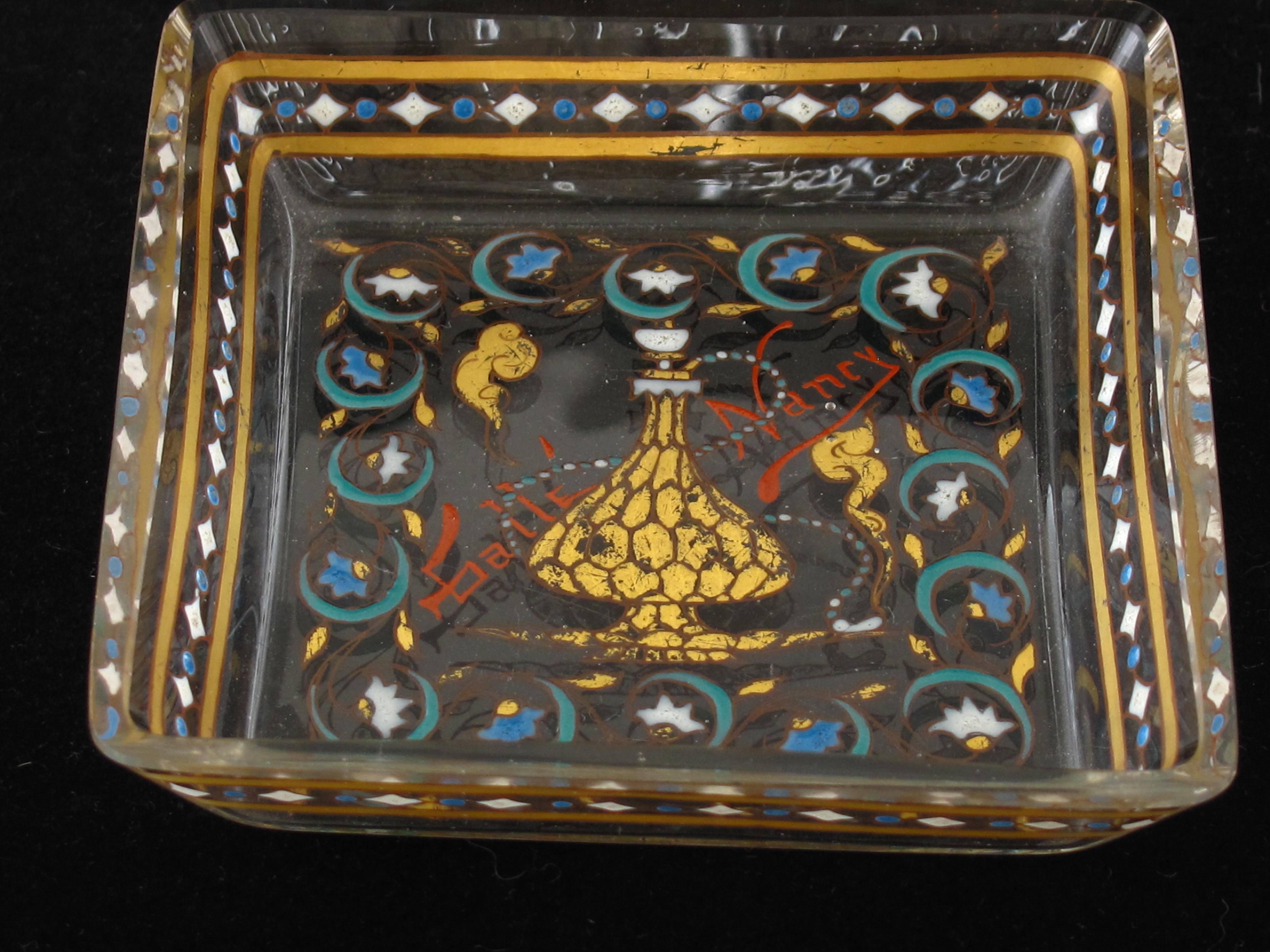 A rare pair of Emile Galle enamel on glass pin trays in the 'Islamic' style. Signed in enamel 'Galle Nancy', French, circa 1895. Approximate size 9 cm square and 1.7 cm deep. In excellent condition with expected wear to the enamel.
Emile Galle