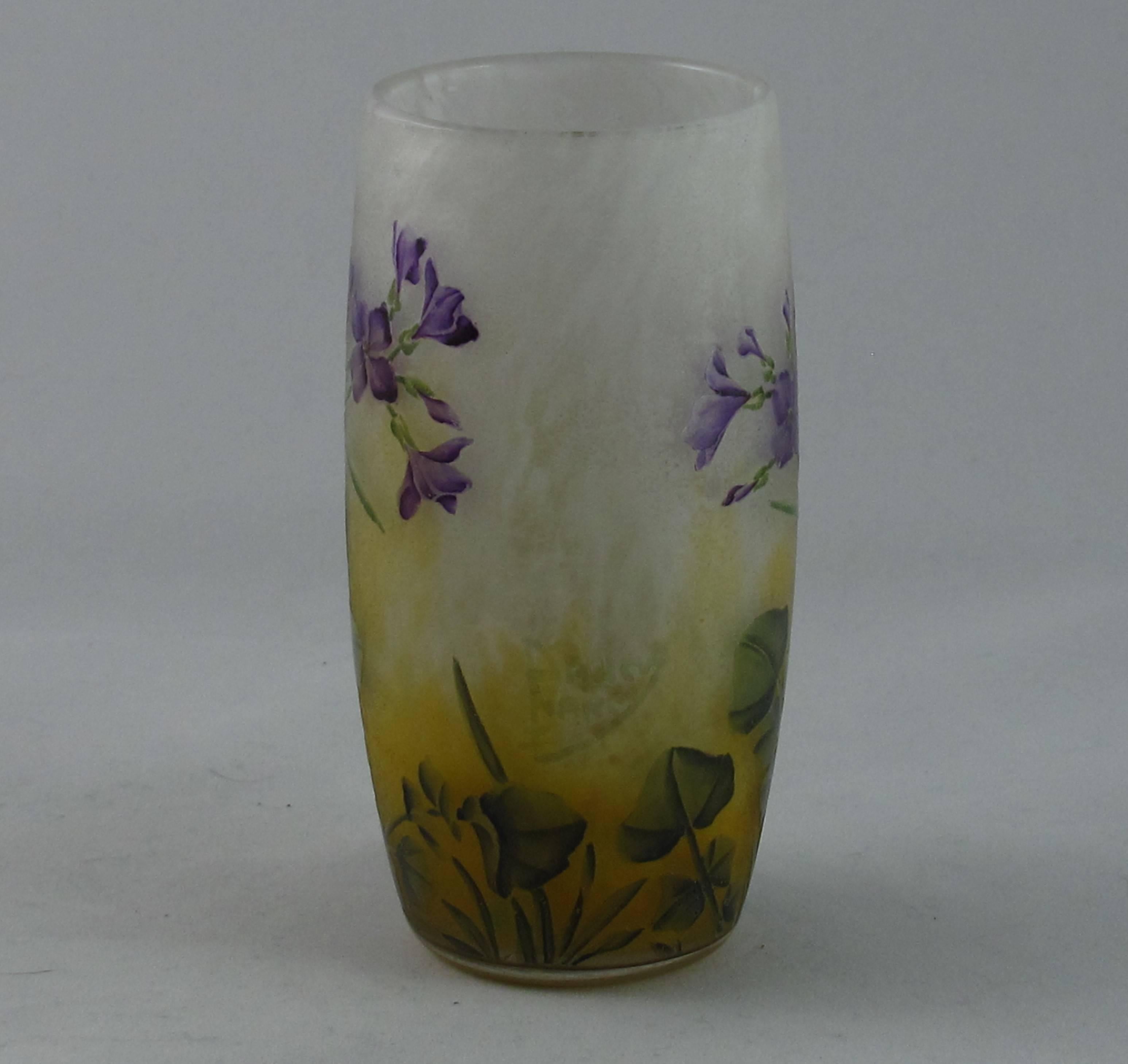 Art Nouveau Daum vase. Finely acid etched and enameled with Violet flowers and leaves. The signature Daum Nancy and the Cross of Lorraine is all in cameo. A charming piece and excellent example of this type of work, French, circa 1900. Excellent