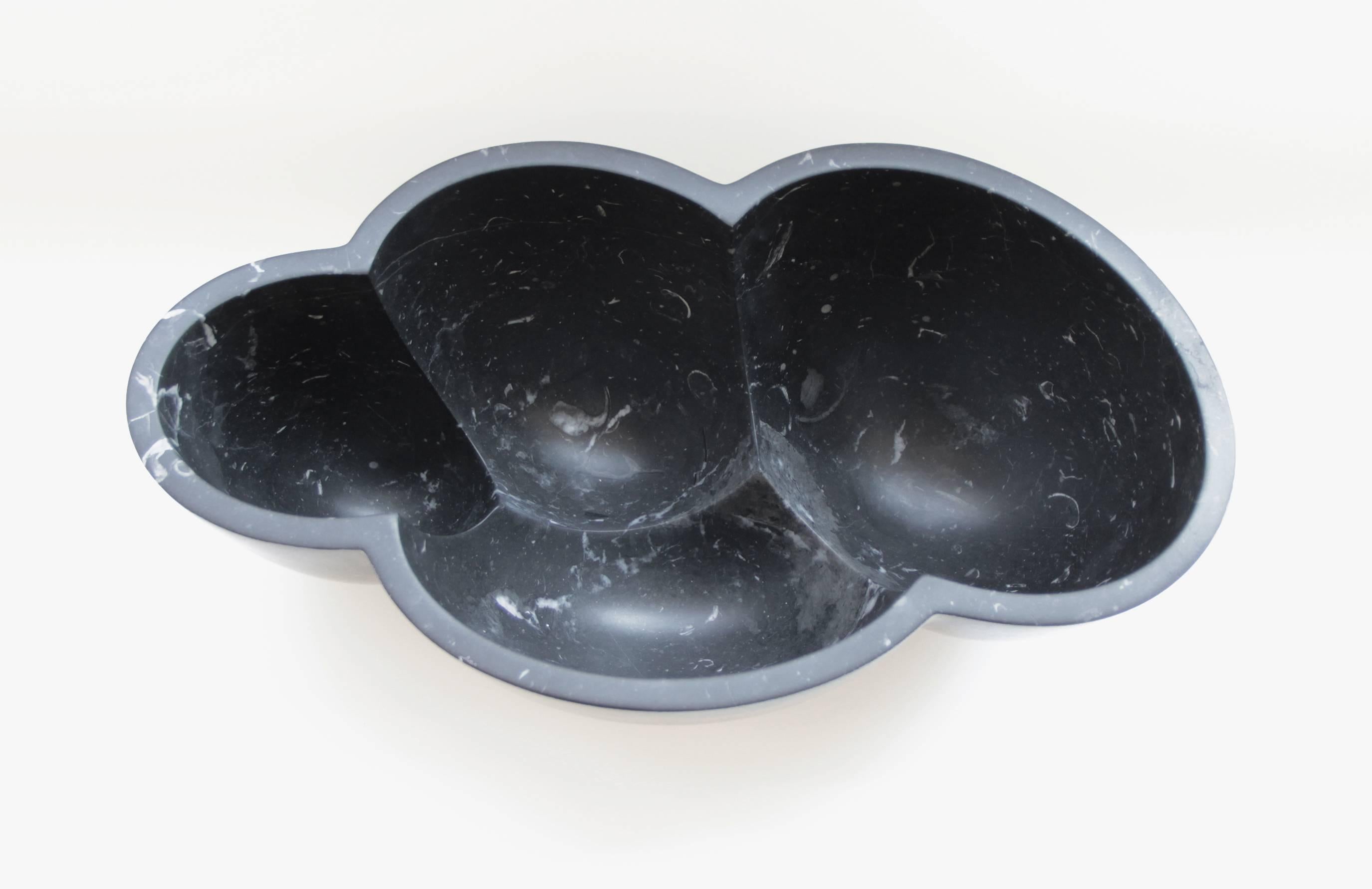 Made in Italy, the 'Nube' black marble vessel is inspired by clouds and amorphous designs found in nature. Skillfully carved from Nero Marquina marble, and utilizing CNC technology this sculptural bowl is honed finished by hand. Through refined