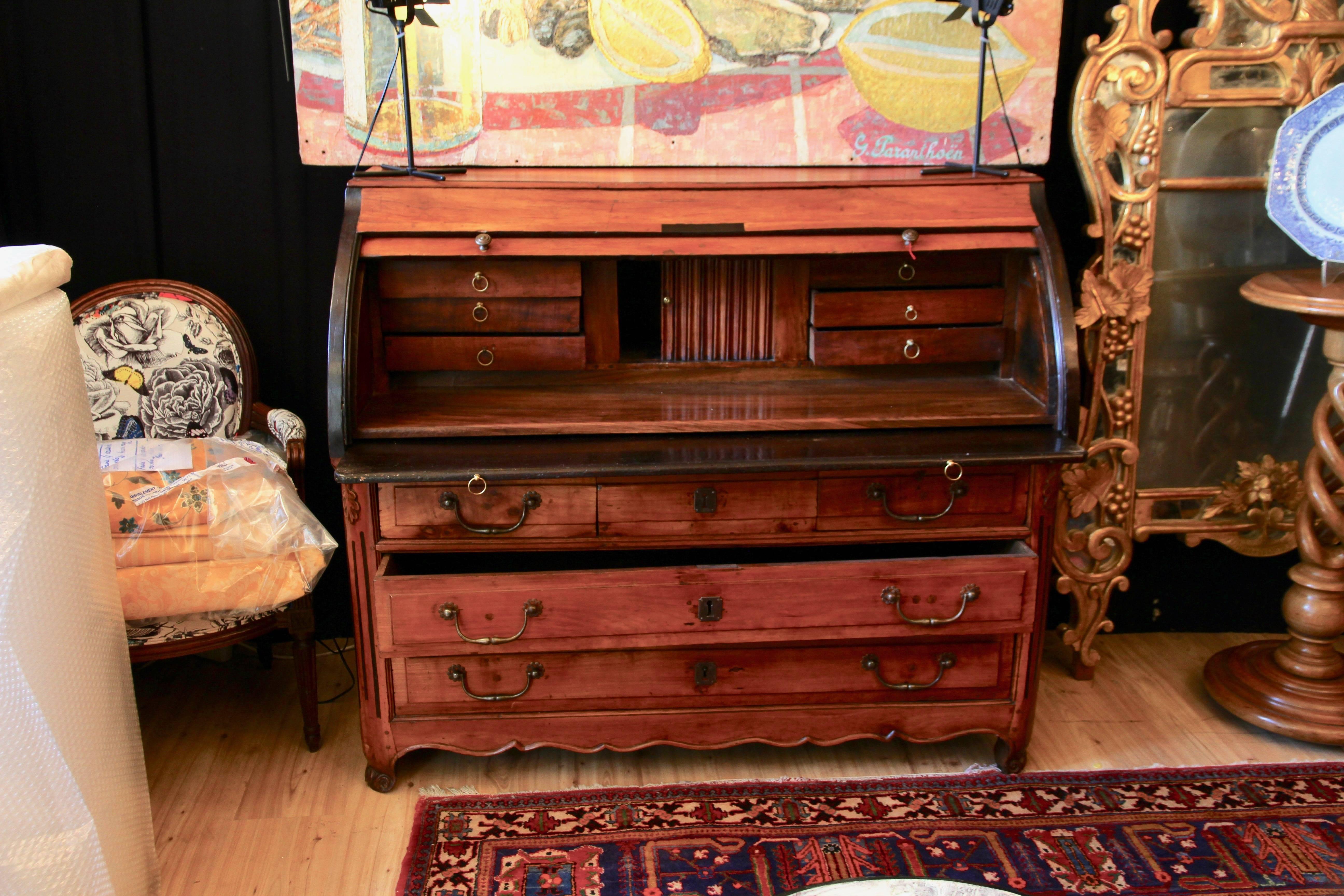 Delightful writing cabinet in marquetry in massive cherry tree. Keyholes and handles are in bronze, the furniture still has its key. The flap is adorned with a charming marquetry work revealing certain particularity of the furnitures made in