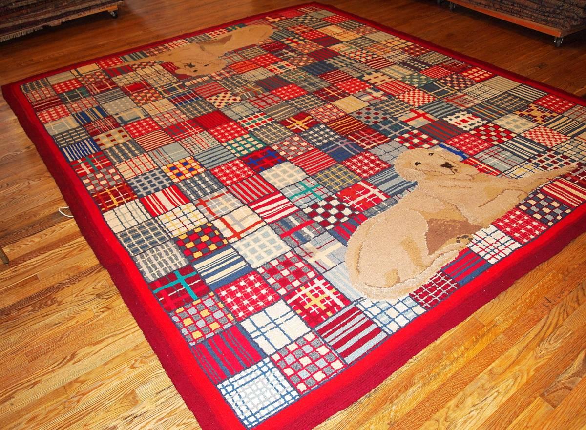 Handmade vintage American hooked rug in original condition. This magnificent rug was made in 1950-1960 in a modern style on that time. The pattern on the rug is geometric in different variety of colors and Labrador dogs on each end. The rug was made