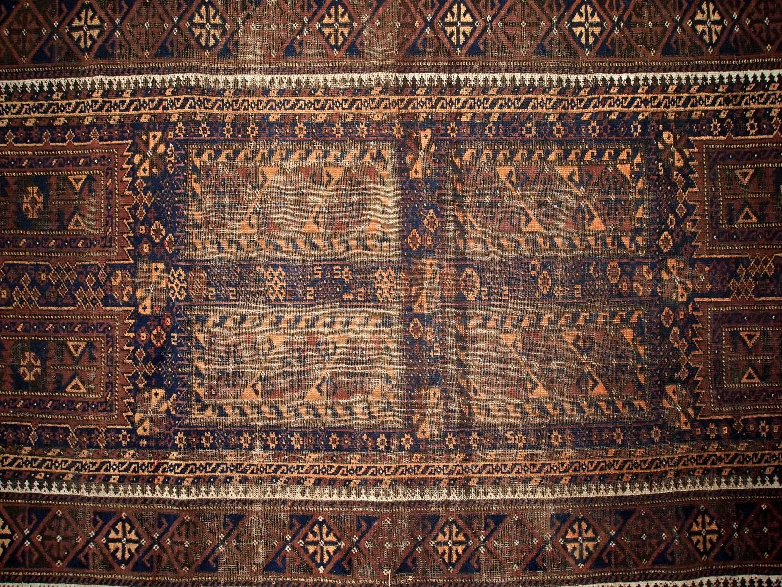 20th Century Handmade Antique Distressed Afghan Baluch Oriental Rug, 1900s, 1C227 For Sale