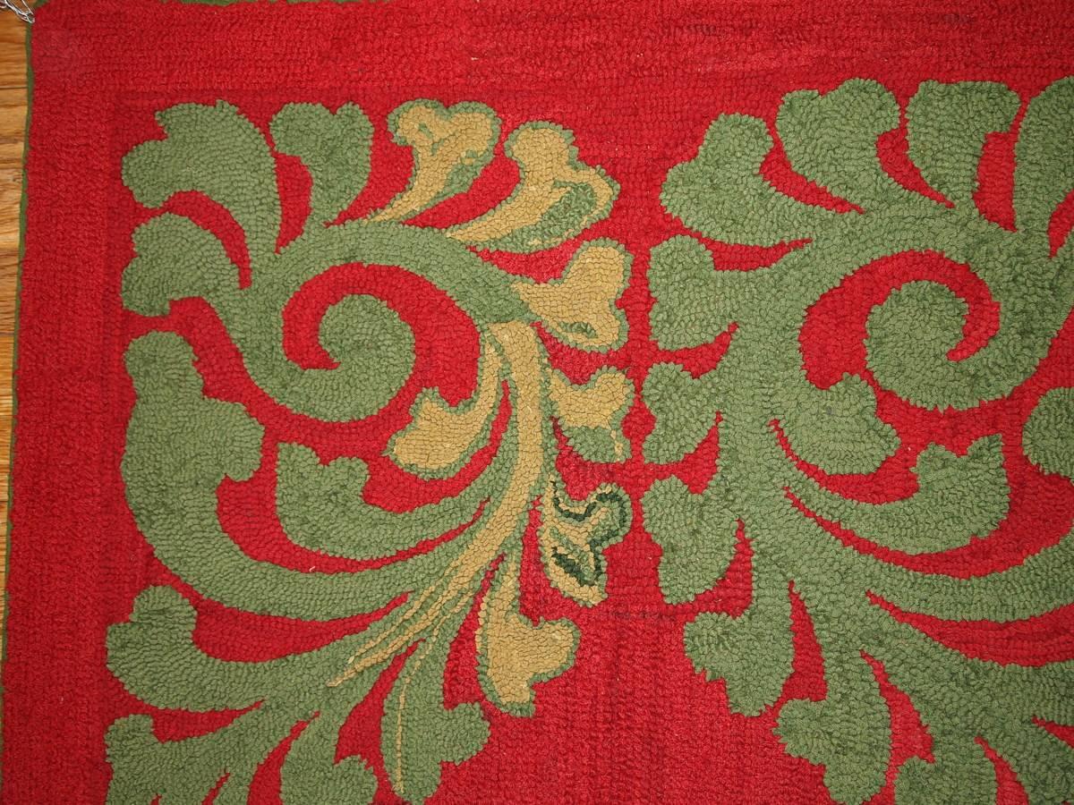 Handmade American hooked rug. Deep red color with green design on it gives some autumn mood.
 