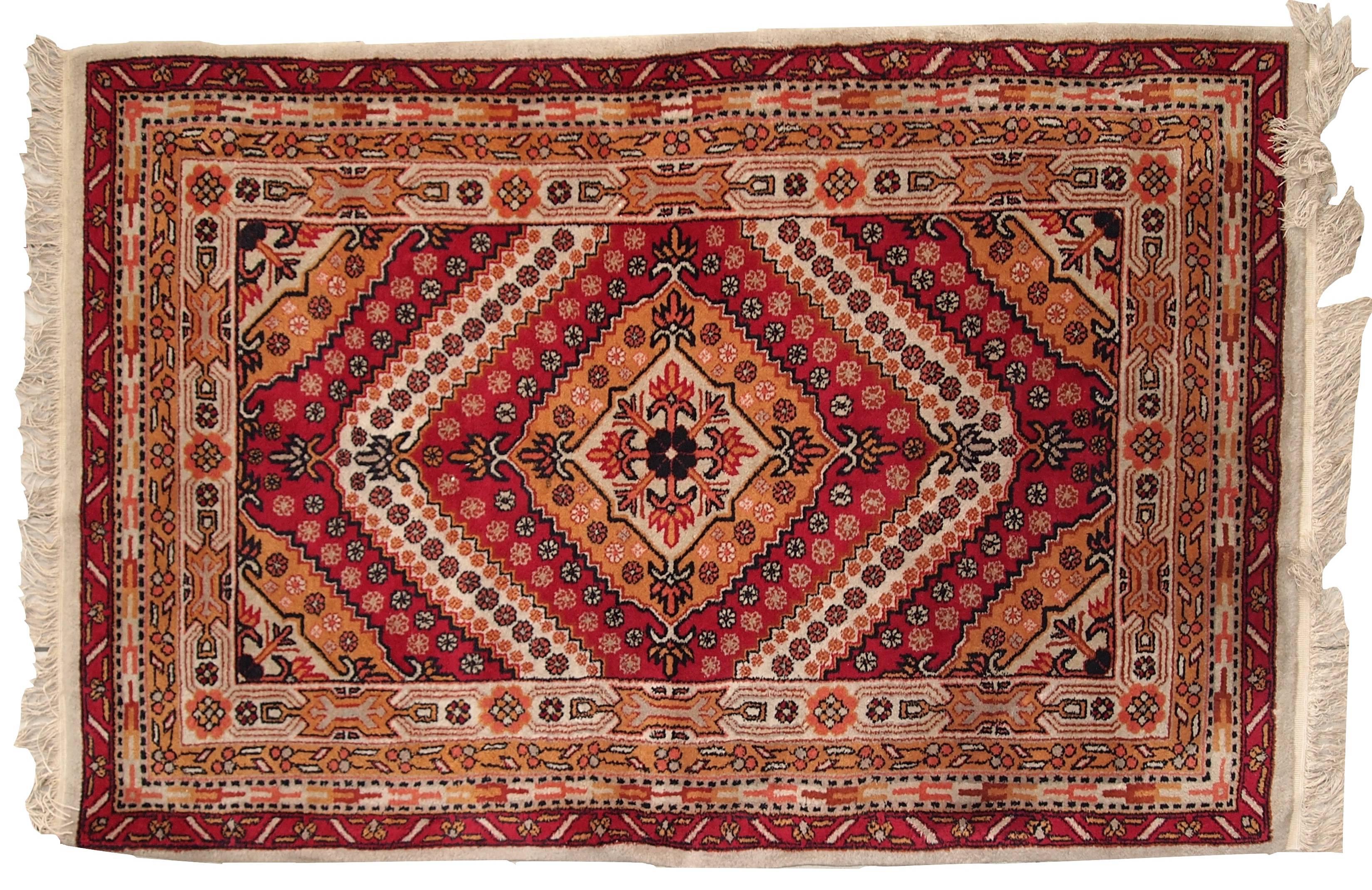 Antique Art Deco Chinese rug in red color. This handmade masterpiece is in a good original condition, very thick with full soft pile. The background is in red colour covered with increasing diamonds from the centre in golden and white shades. Little