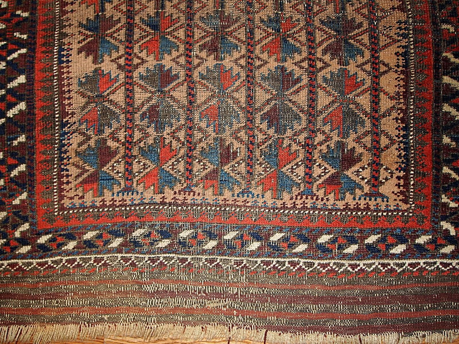 Collectible Afghan prayer Baluch rug with cream field and tribal design on it. This rug is prayer and in fair condition.