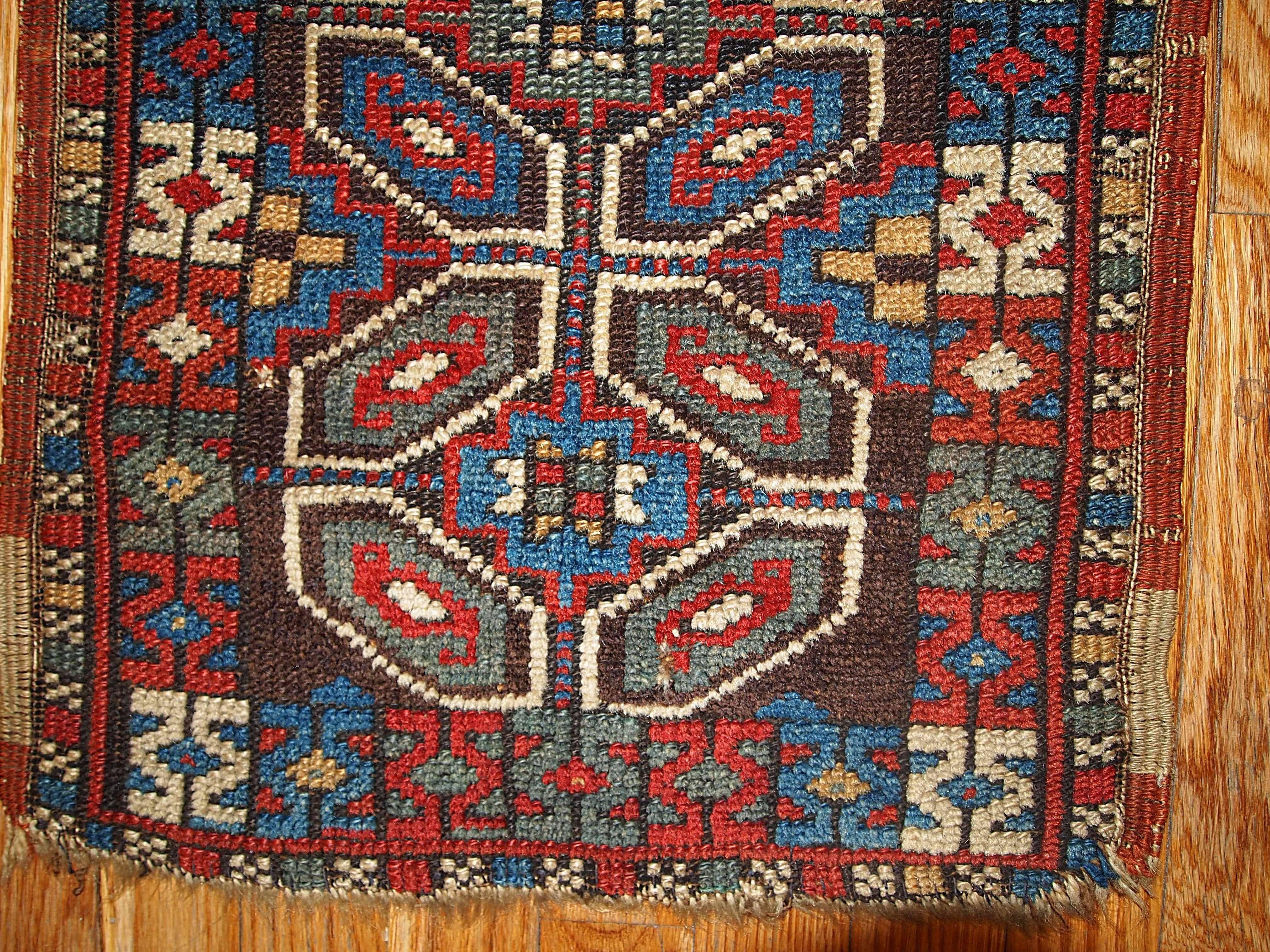 This Turkish Yastik has very rare design of Persian Khamseh rug. Same geometric style and shapes. Even the colors of chocolate brown, blue, beige and red which they used on it are more related to Persian Khamseh type of rugs. But the weave is most