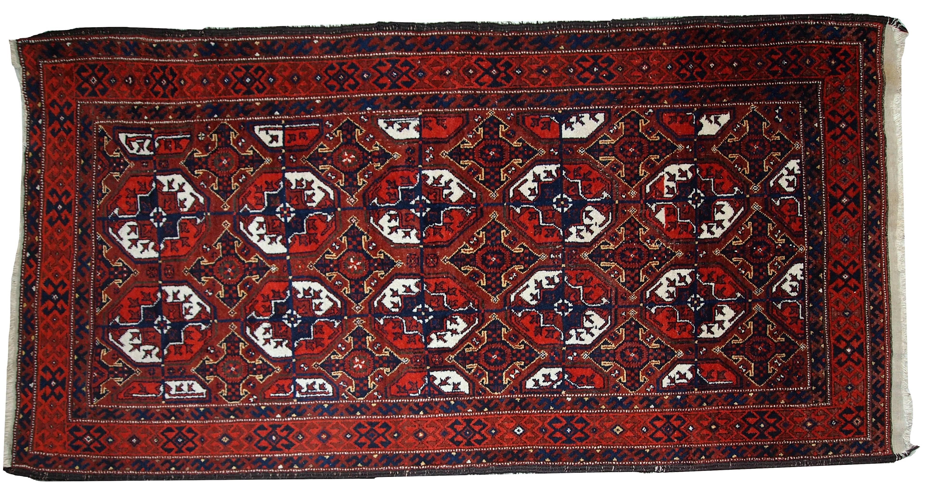 Antique handmade Afghan Baluch rug. This Afghan rug has beautiful bright colors of red, white, burgundy, and blue. Very nice repeating design in the center and tribal border around. The condition of this rug is original and good. It has nice, soft