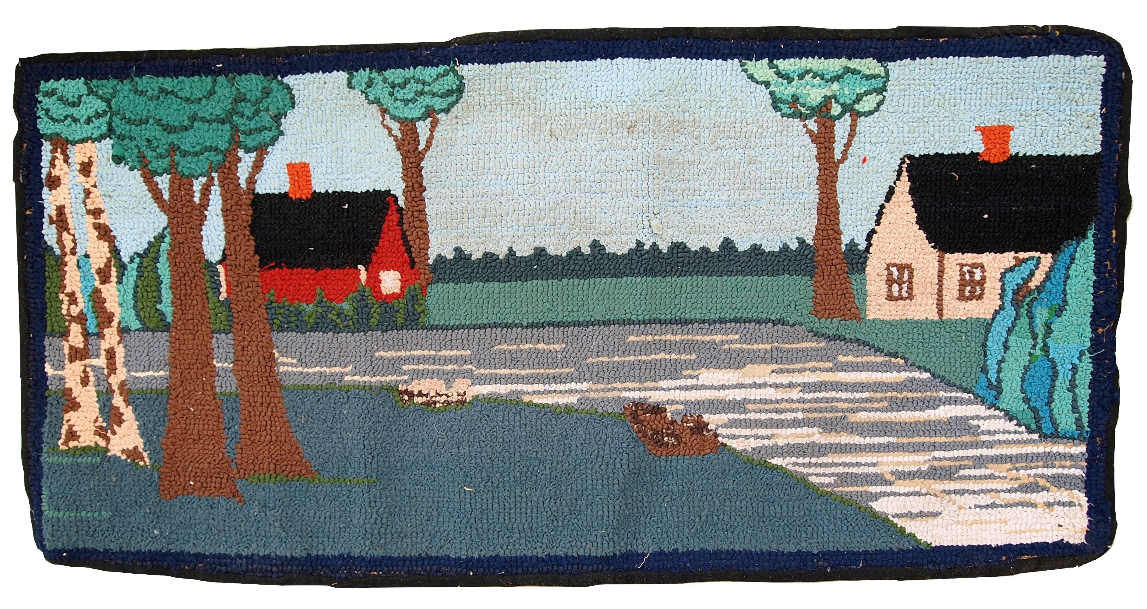 Handmade vintage American hooked rug in good condition. The rug has been made in pictorial decorative design. On the image is the regular American street with the red and beige houses surrounded by a trees. The rug is in original good condition.
  