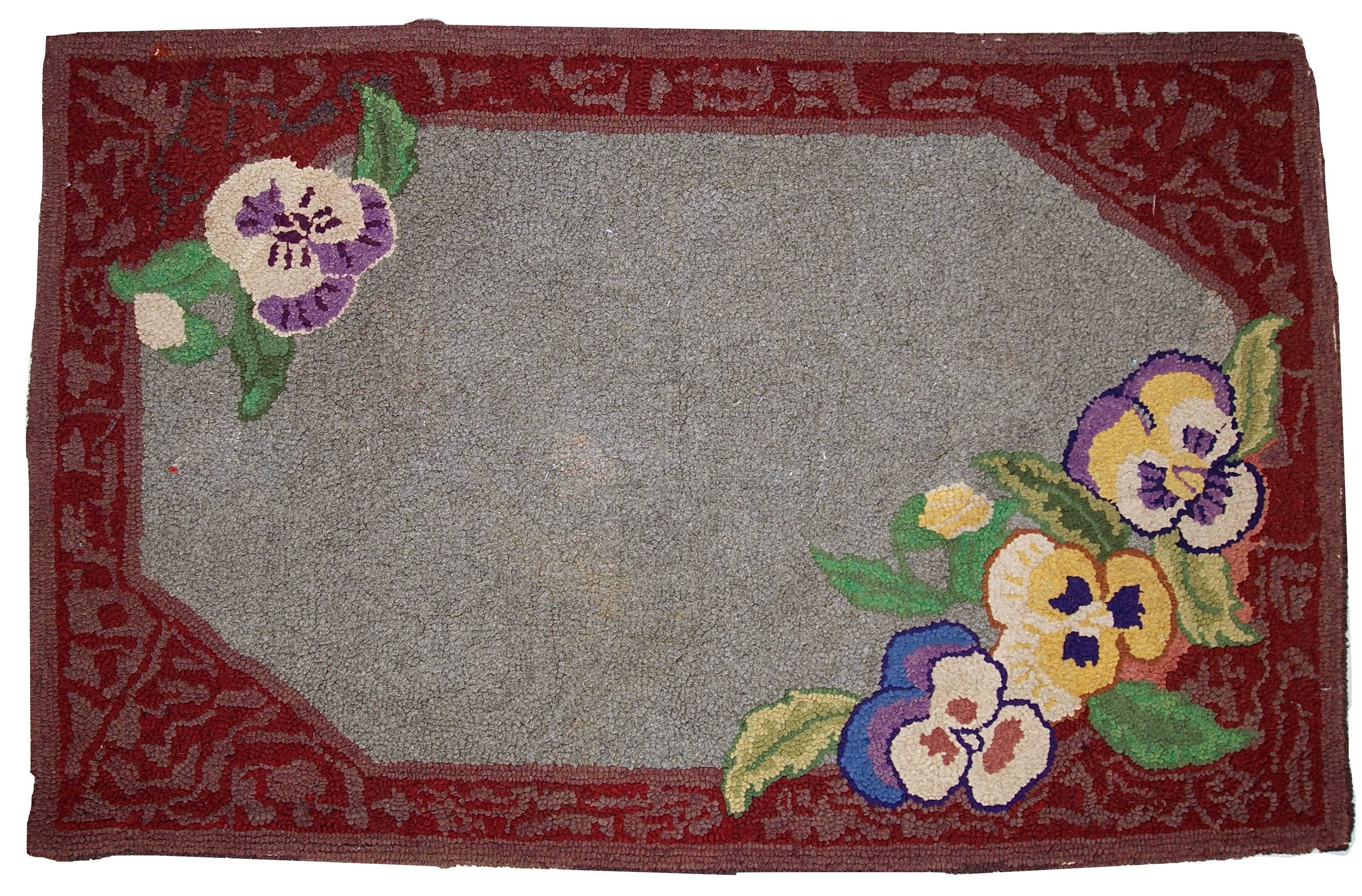 Antique decorative American hooked rug. Beautiful all-over design in grey shade decorated with wonderful burgundy border with abstract decoration on it. Flowers are in two corners of the rug. The condition is original and good. 64cm x 102cm
 