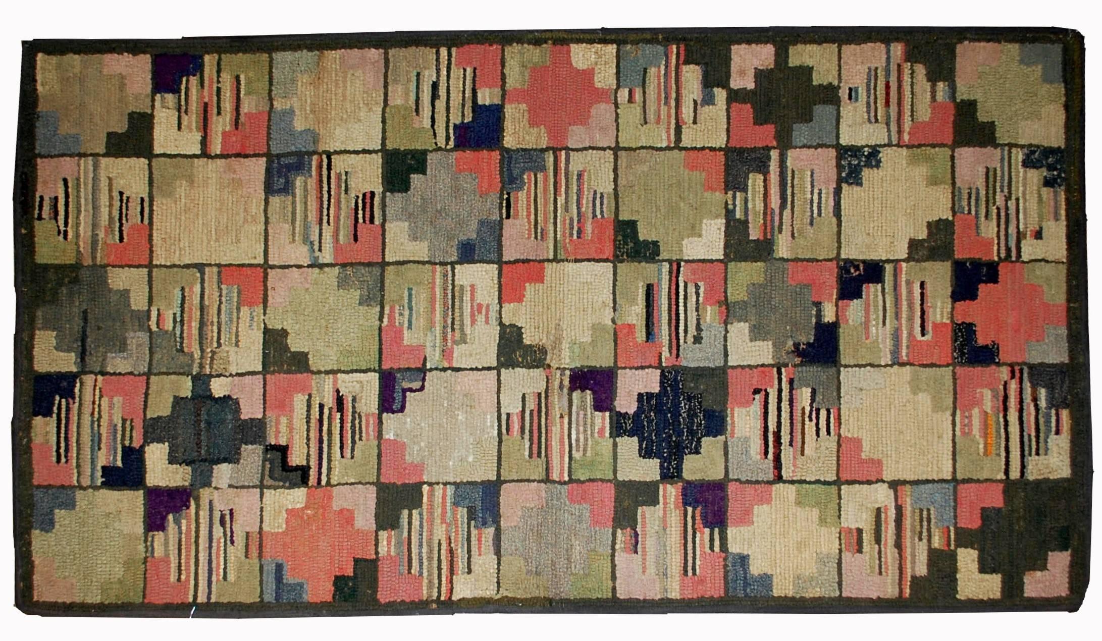 Handmade antique American hooked rug in good condition. The rug made in geometric design in colourful shades. The rug has been restored and now in good condition.
  