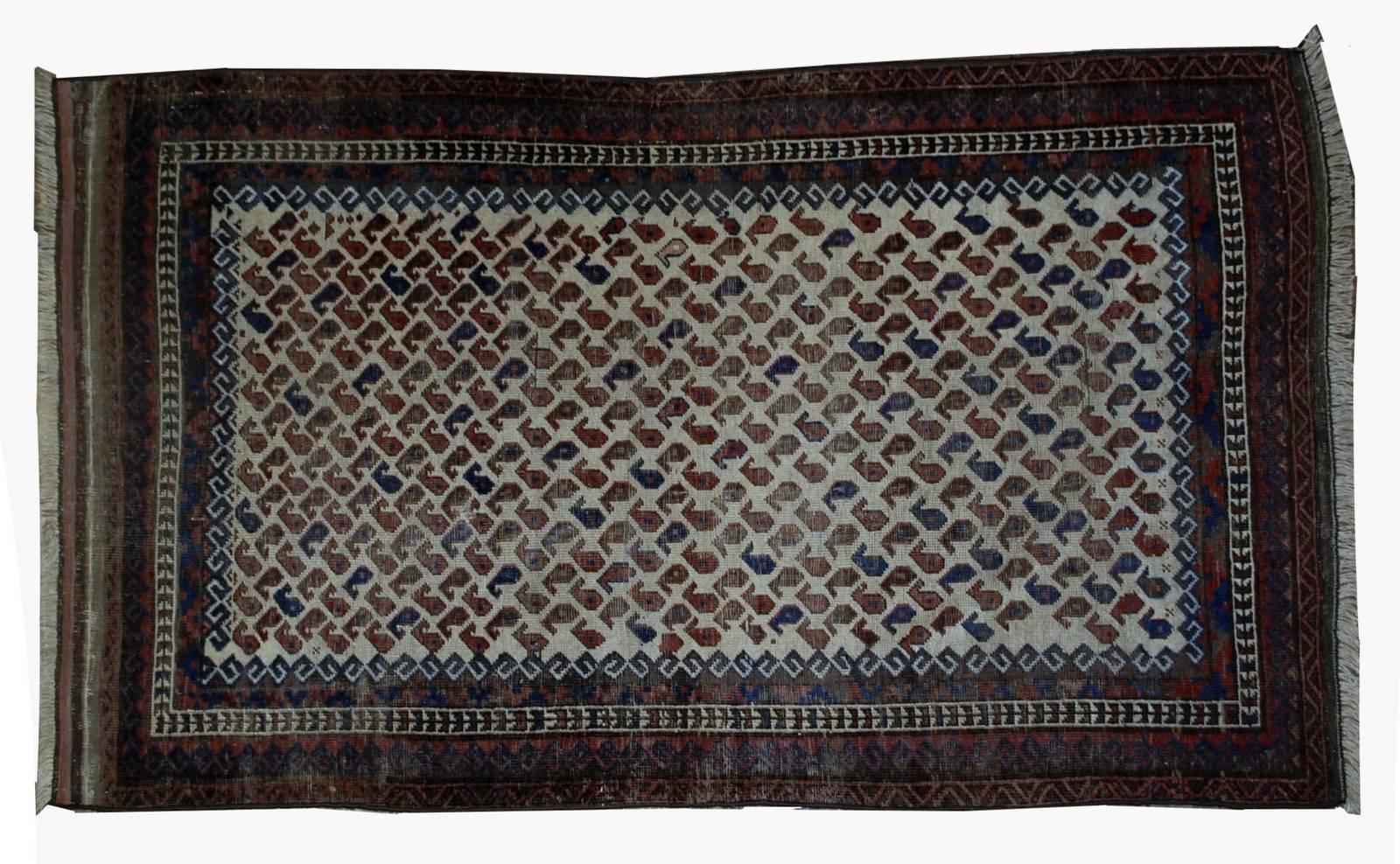 Antique handmade Afghan Baluch rug in original condition. The rug is from the end of 19th century. It has all-over 