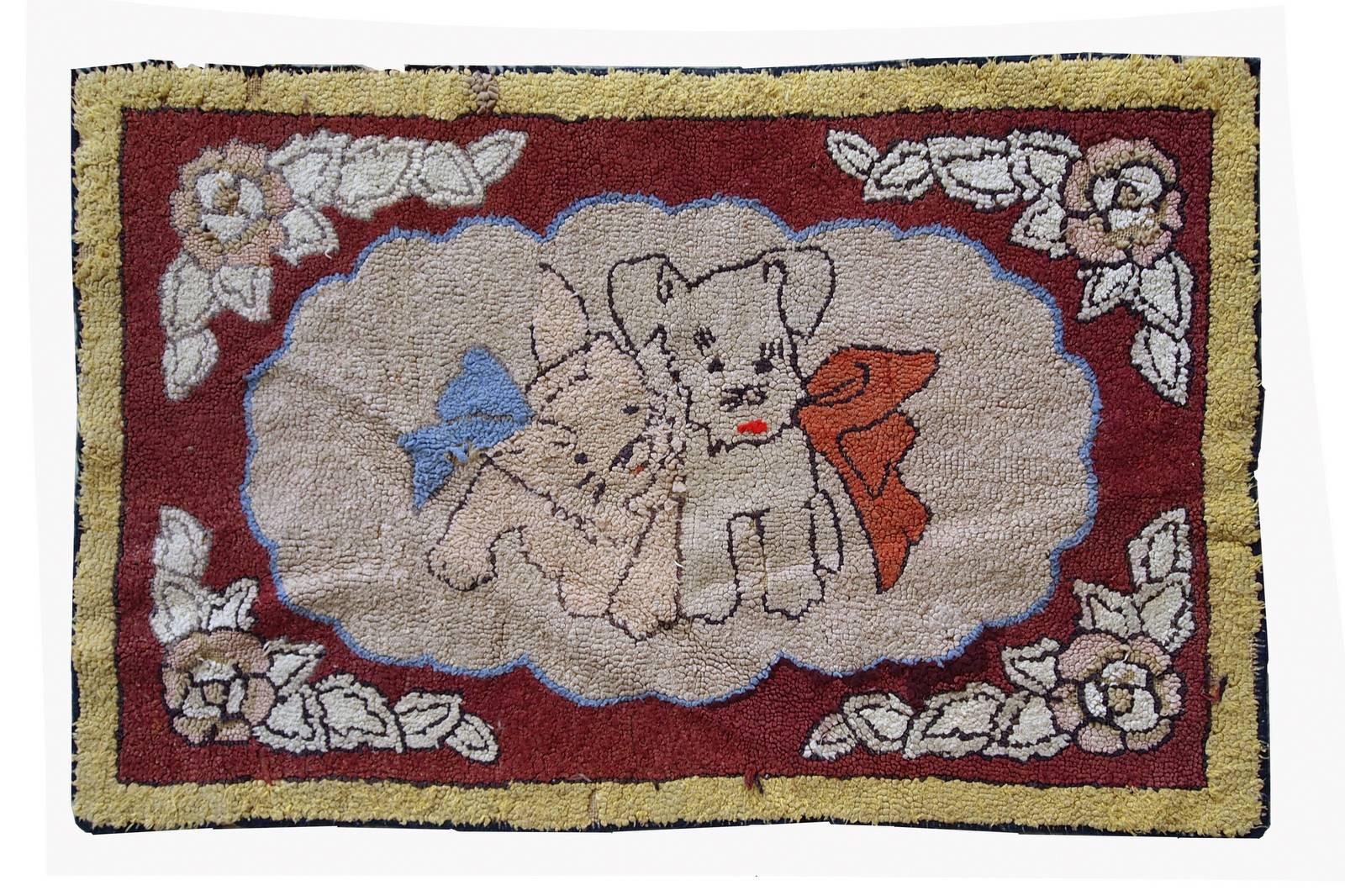 Antique American hooked rug in good condition. The rug looks like an image in the frame with the pictures of two dogs on it with the sky blue and brick red scarfs. Yellow border is the frame of that image. The rug has been restored and in good