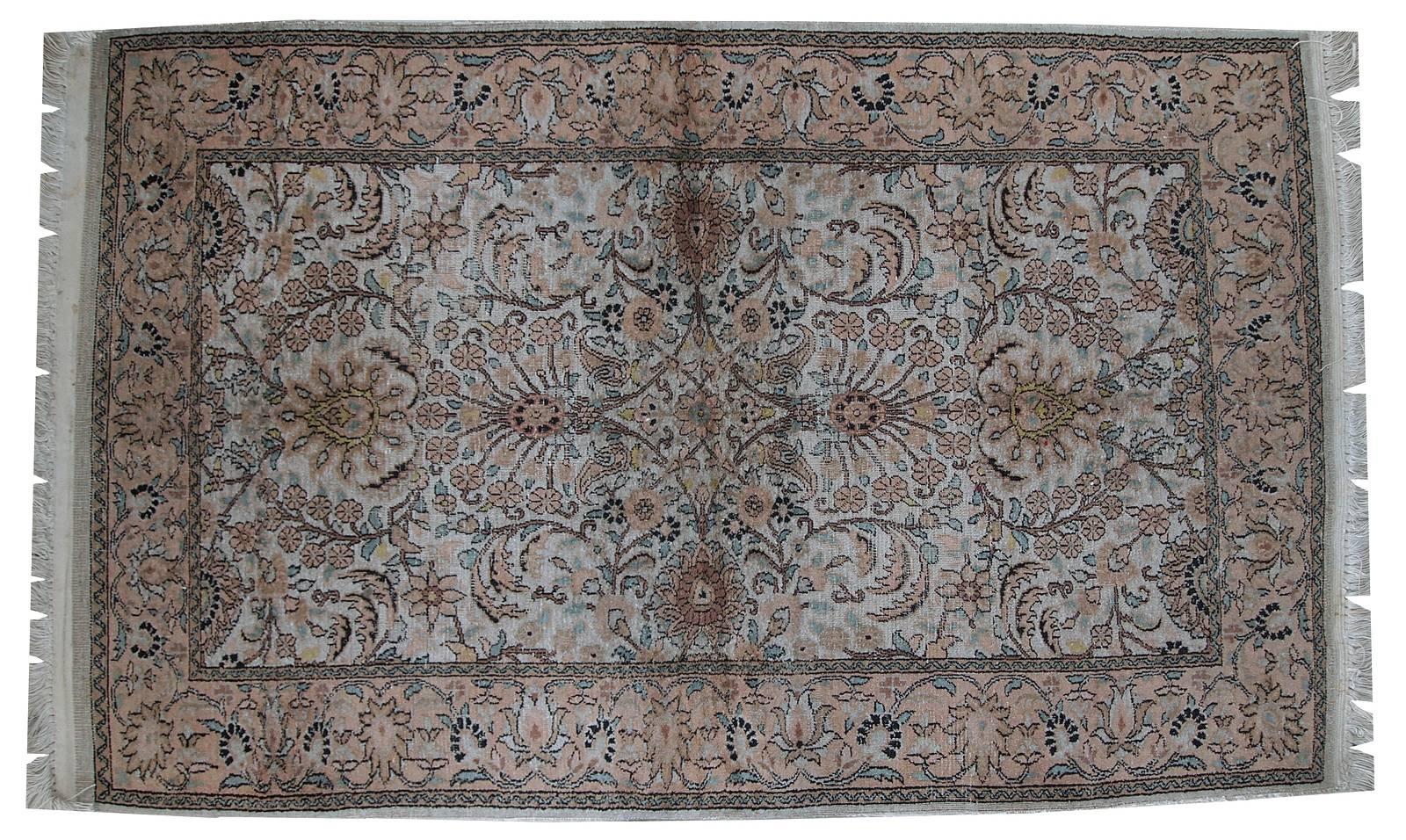 Vintage silk Indo-Tabriz rug in original condition. This is Indian rug made in Persian style of Tabriz city. Very soft shades of beige and peach are on the rug. The design is busy, floral. Very nice soft silk on cotton. The rug is in original