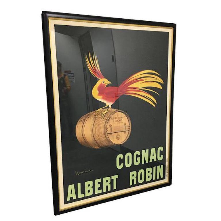 Vintage French poster. "Cognac Albert Robin" depicts a bird sitting upon a barrel of Cognac. The poster has been custom matted and framed so it is ready to enhance your space. Vintage liquor poster by Leonetto Cappiello is beautifully