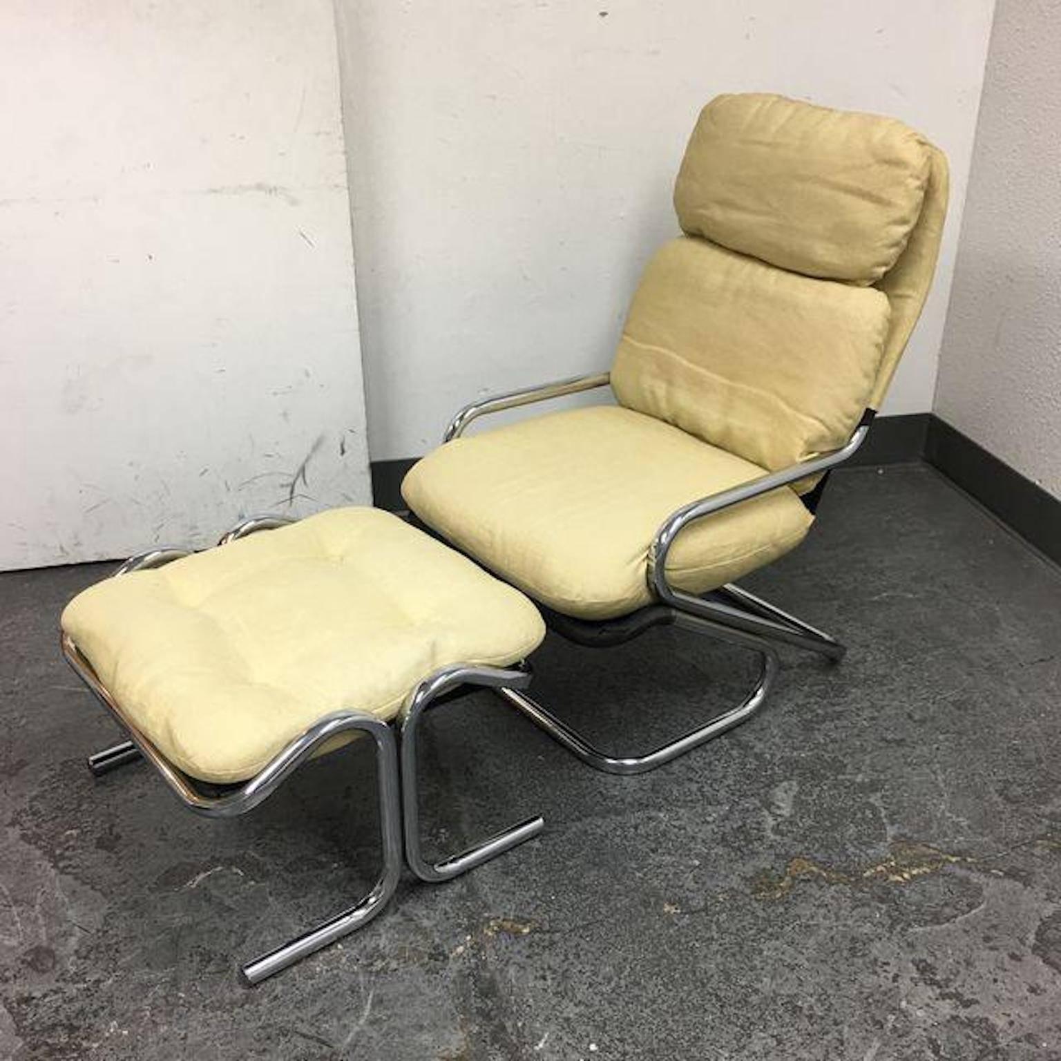 A Landes Manufacturing Company sling chair ottoman. Manufactured by Landes Company. The high back lounge chair and ottoman are made from bent chrome tubes fused together. The sling is a black canvas, includes original sets of wheat linen tufted