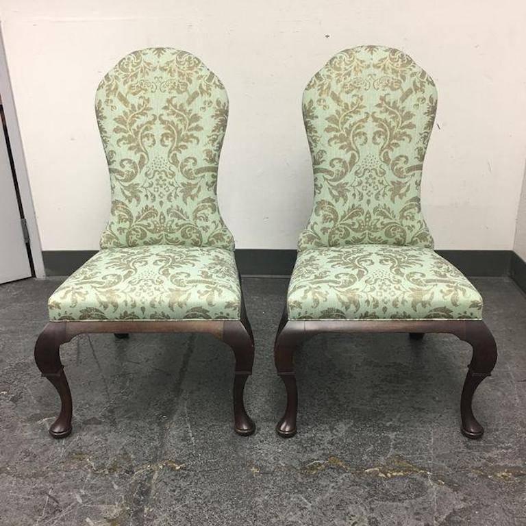 A pair of Lemont side chairs by Hickory Chair. Since 1911, Hickory Chair has maintained an old-school dedication to fine craftsmanship, particularly when it comes to upholstery. This charming side chair features a green and taupe damask upholstery