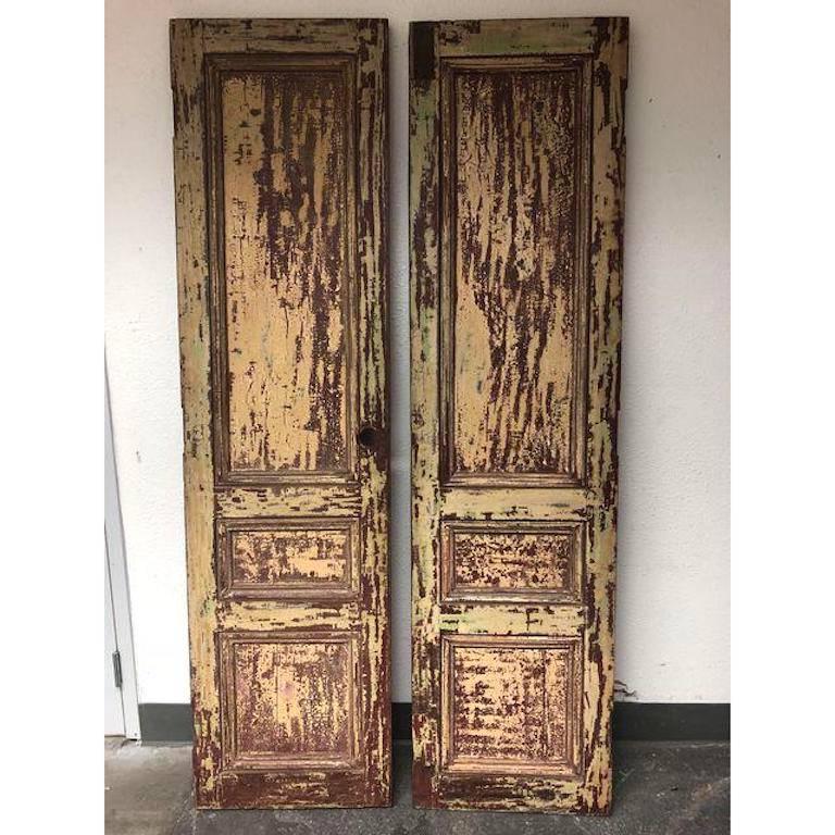 A one of a kind pair of doors. The doors were hand carved for La Casa Zaldivar in El Salvador-Pacheco in or circa 1906. The doors were only allowed to leave the country after the mass destruction from the earth quake in 2000. These doors truly are