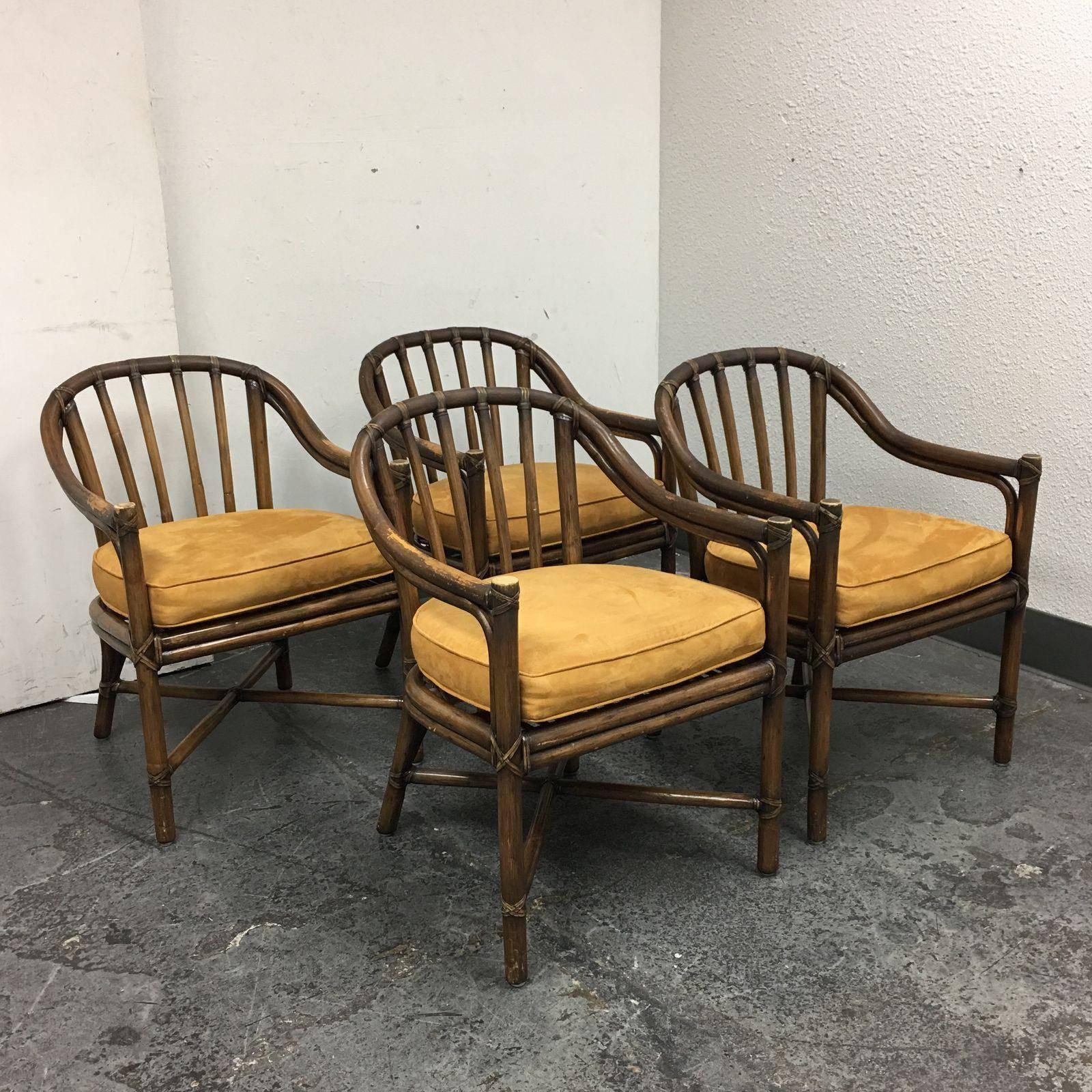 A set of four bamboo frame McGuire chairs. A Classic barrel back bamboo frame with a leather wrapped. The bamboo and leather shows distressed which add the characteristics to the beauty that McGuire can continue to withhold, no matter how old the