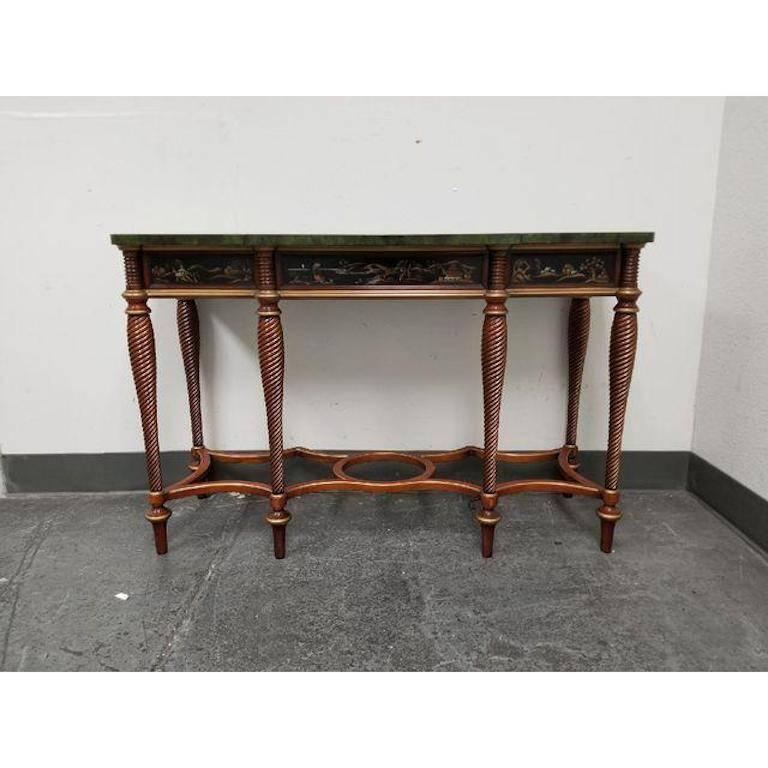 A console table from the Mario Buatta collection for John Widdicomb. A stunning cheerywood console table with a top surface of a faux green marble. The remarkable features of this 19th century English design include the breakfront shape top; the