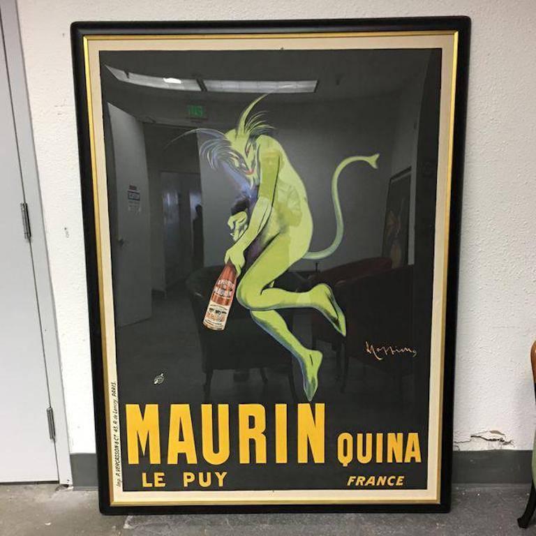 Collectible French poster. "Maurin Quina Le Puy France" depicts a green devil opening a bottle of spirits with a tempting look on his face. This green devil, circa 1906, vintage liquor poster by Leonetto Cappiello is beautifully matted and