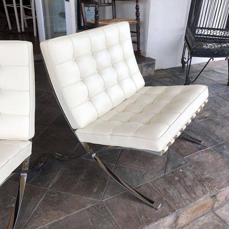 A Pair of Barcelona chairs from Knoll. This iconic chair which was designed Ludwig Mies van der Rohe in 1929. One of the most recognized objects of the last century. The Barcelona Chair exudes a simple elegance that epitomizes Mies van der Rohe's