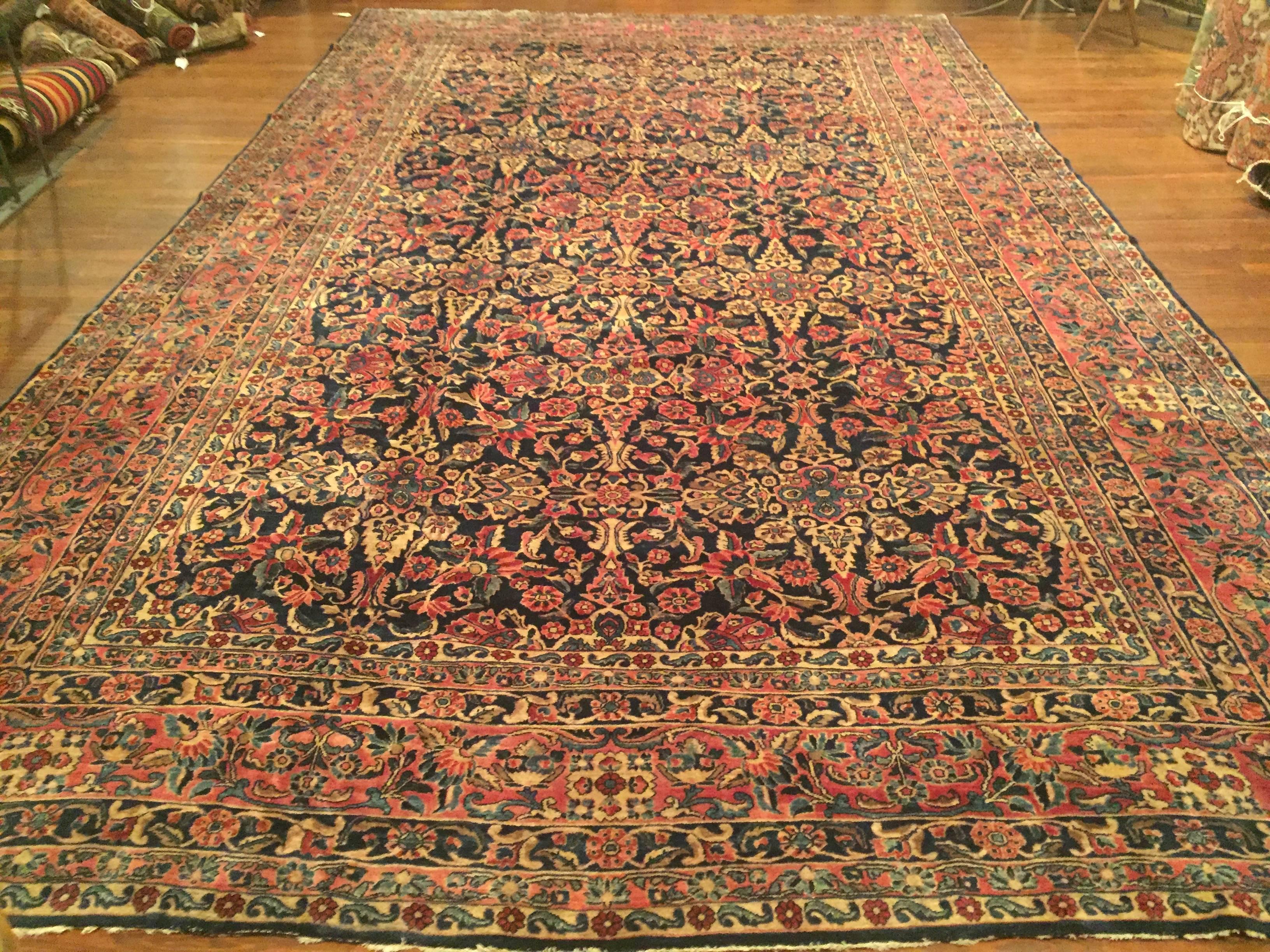 An antique Persian Sarouk rug, circa 1900.