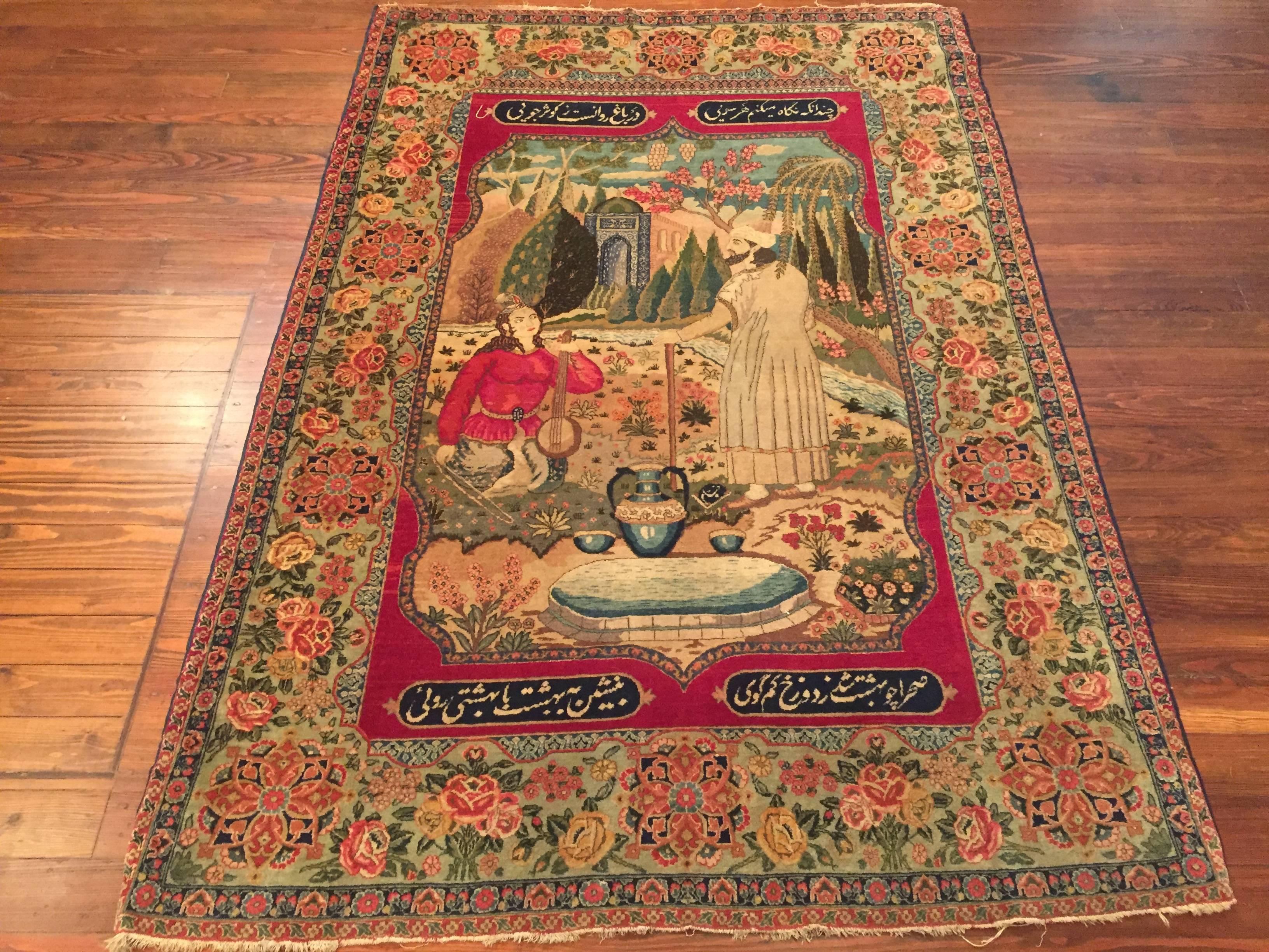An antique Persian pictorial Tabriz rug, circa 1900. This rug displays an Omar Khayyam poem.