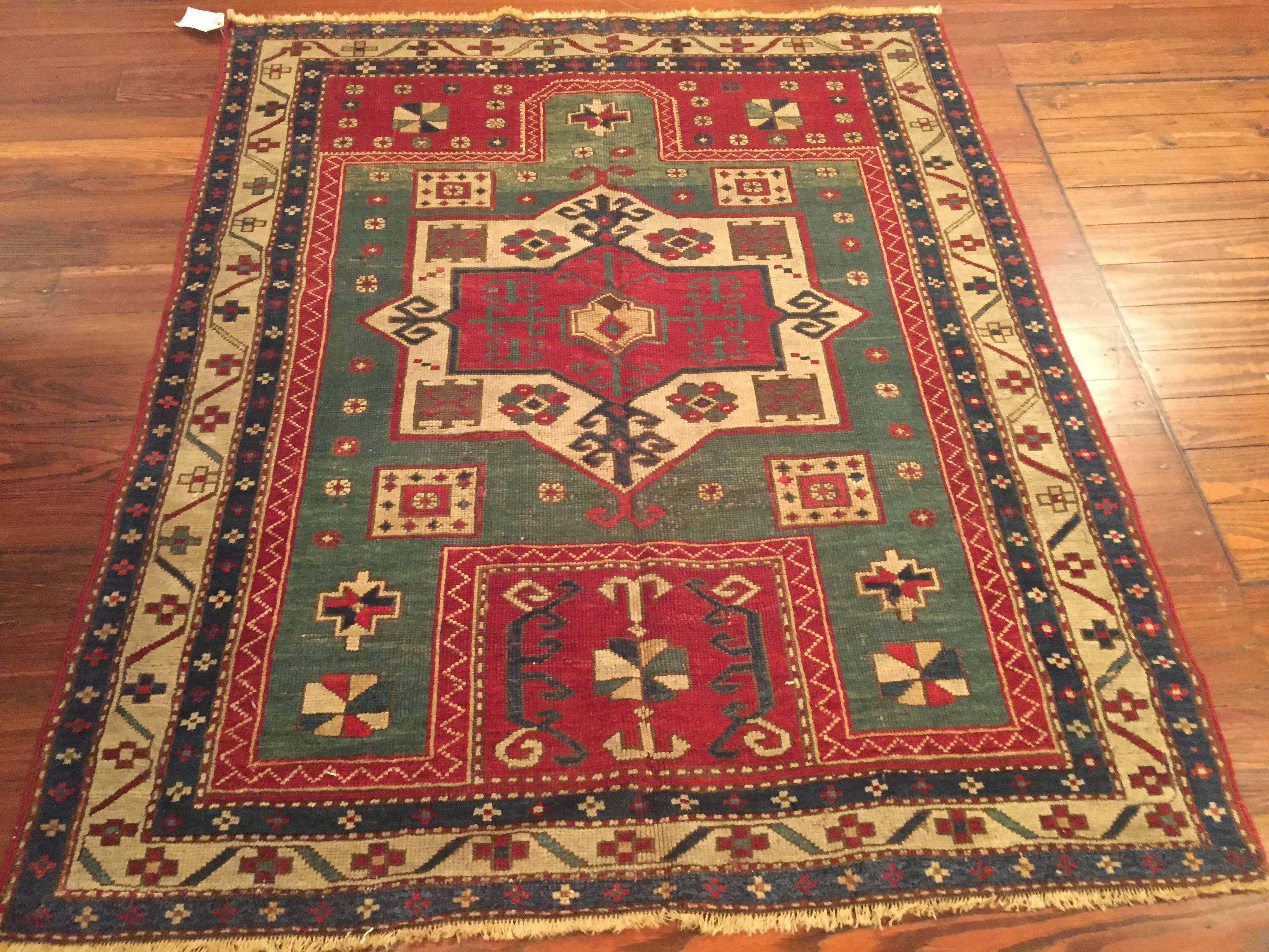 An antique Caucasian Kazak rug with prayer design, circa 1890.