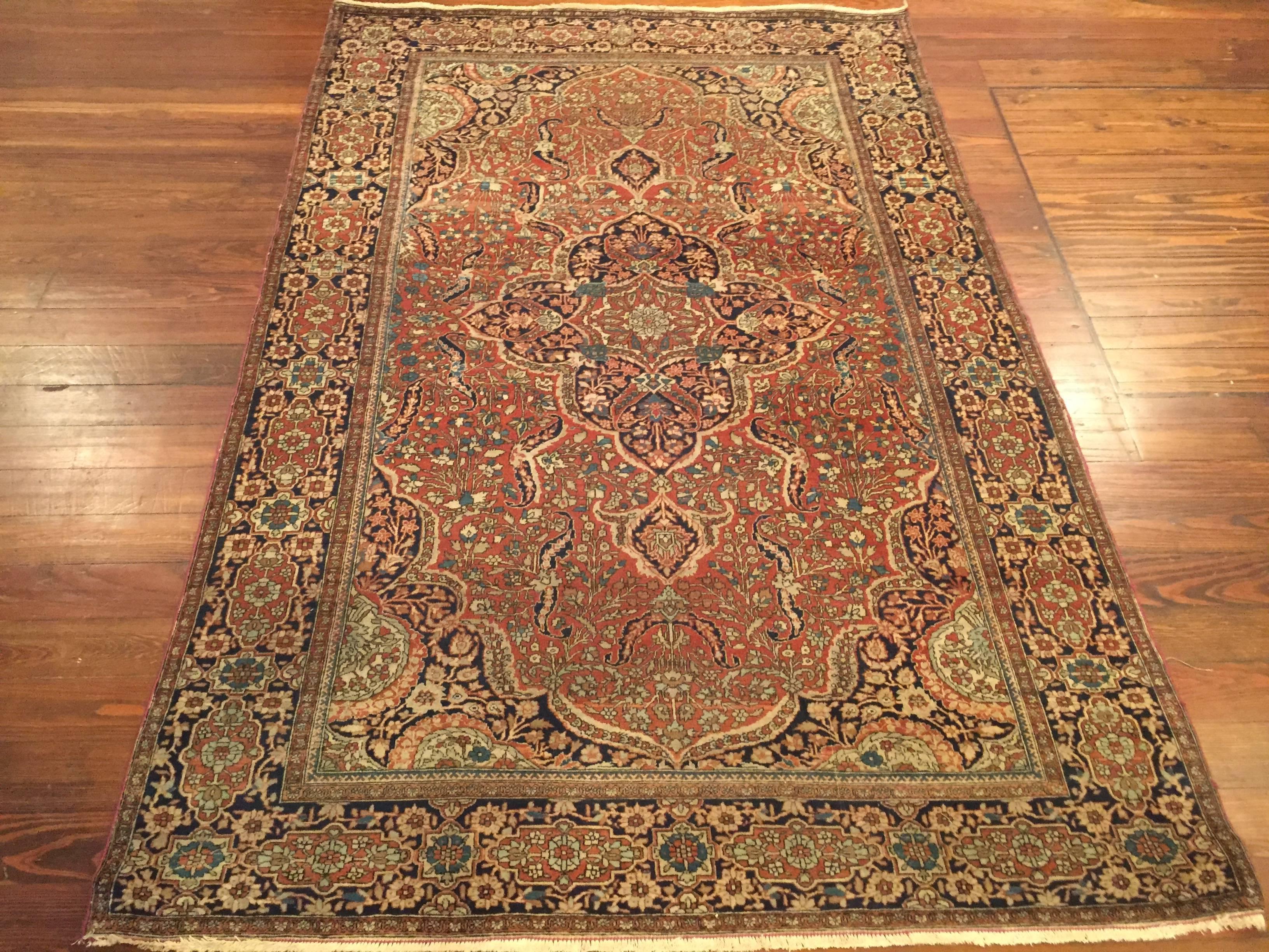 An antique Persian Mohtashem Kashan rug, circa 1890.