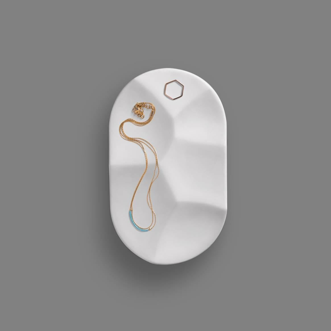 Inspired by the shapes created when yogurt is eaten with a spoon, the carved pill bowl incorporates an elegance and sophistication that will elevate any situation. Its partitions allow the user to easily compartmentalize their favorite belongings