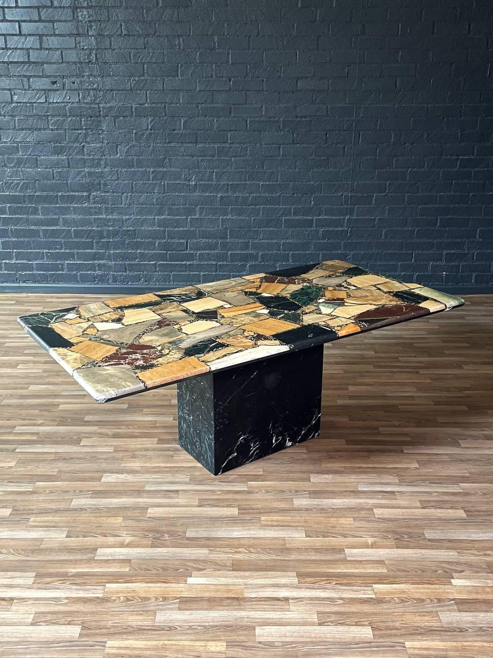 Condition: Original Vintage Condition
Designer: C.I.M
Manufacturer: C.I.M
Materials: Multi-Marble Stone

Crafted in Italy by C.I.M in the 1980s, this striking Post Modern dining table features an intricate patchwork of various richly colored marble