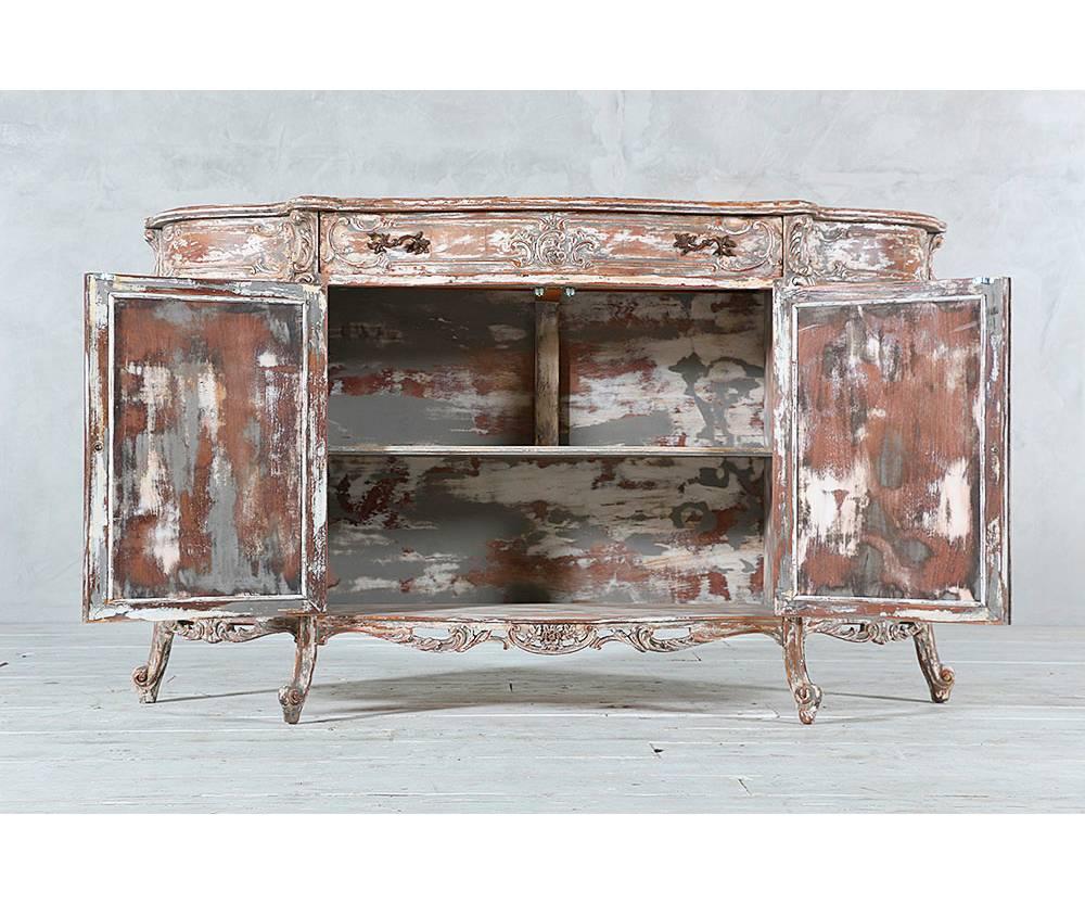 Beautiful 1940s Italian carved wood sideboard or buffet with starburst etched mirrored doors in the Louis XV style. Distressed paint finish.